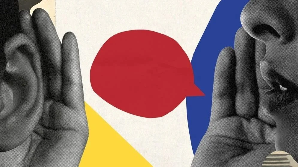 A black and white photo of two people whispering into each other's ears with a colorful abstract background and a red speech bubble.