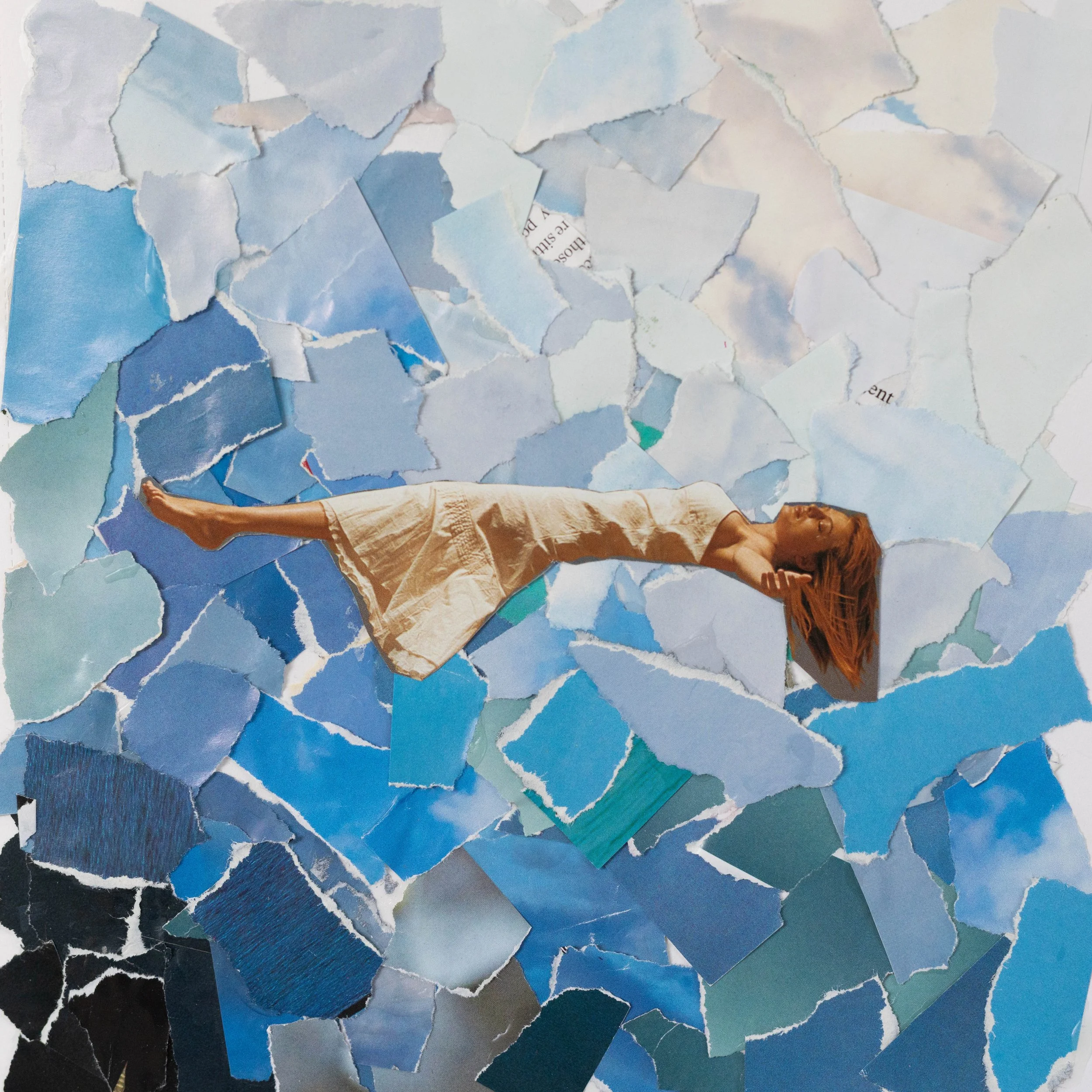 Torn paper collage with layers of sky and ocean images, a person's arm and partial face visible at the bottom right, and torn pieces of text scattered across the composition.