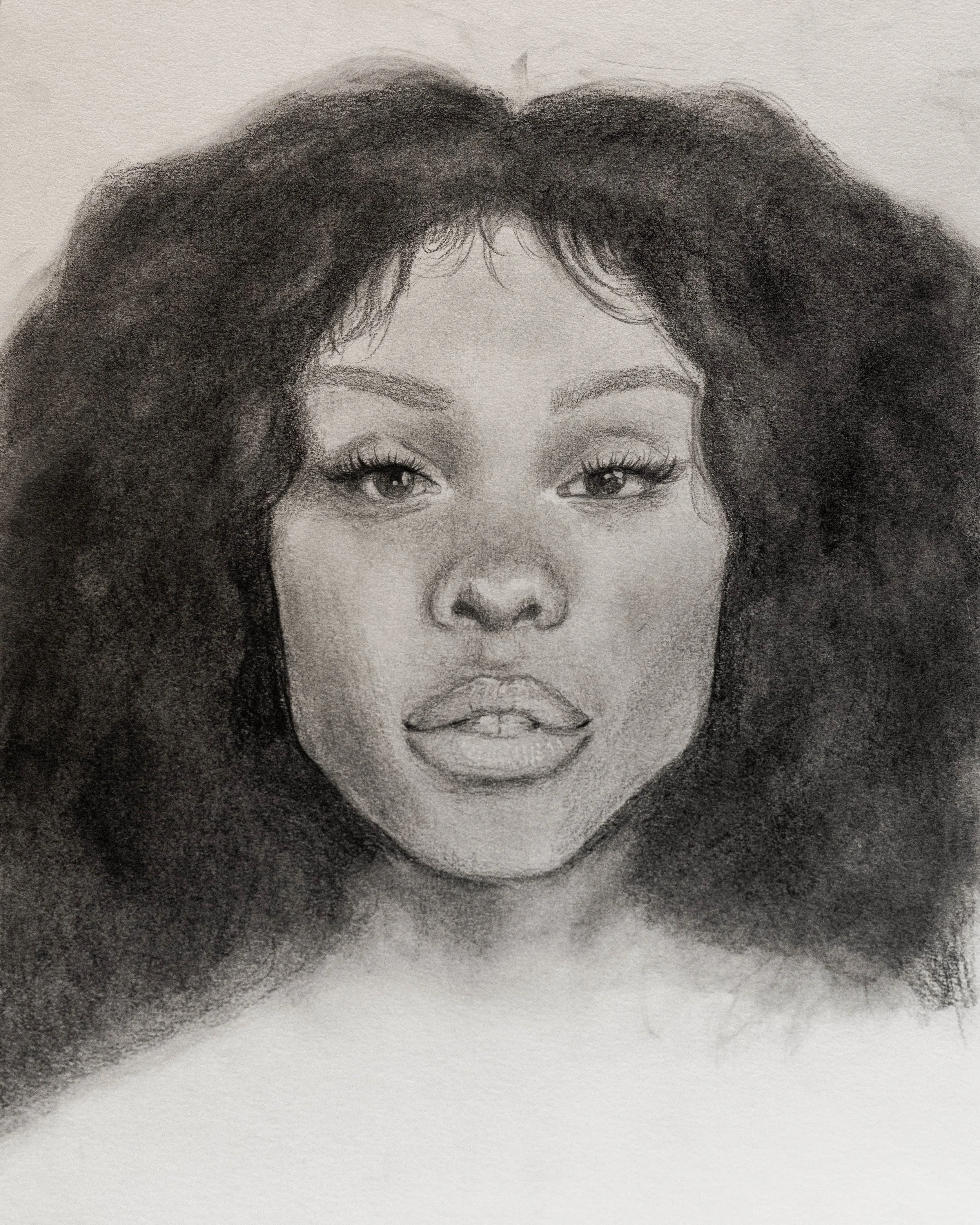 A detailed pencil sketch of a woman's face, showing her eyes, nose, lips, and black, curly hair.
