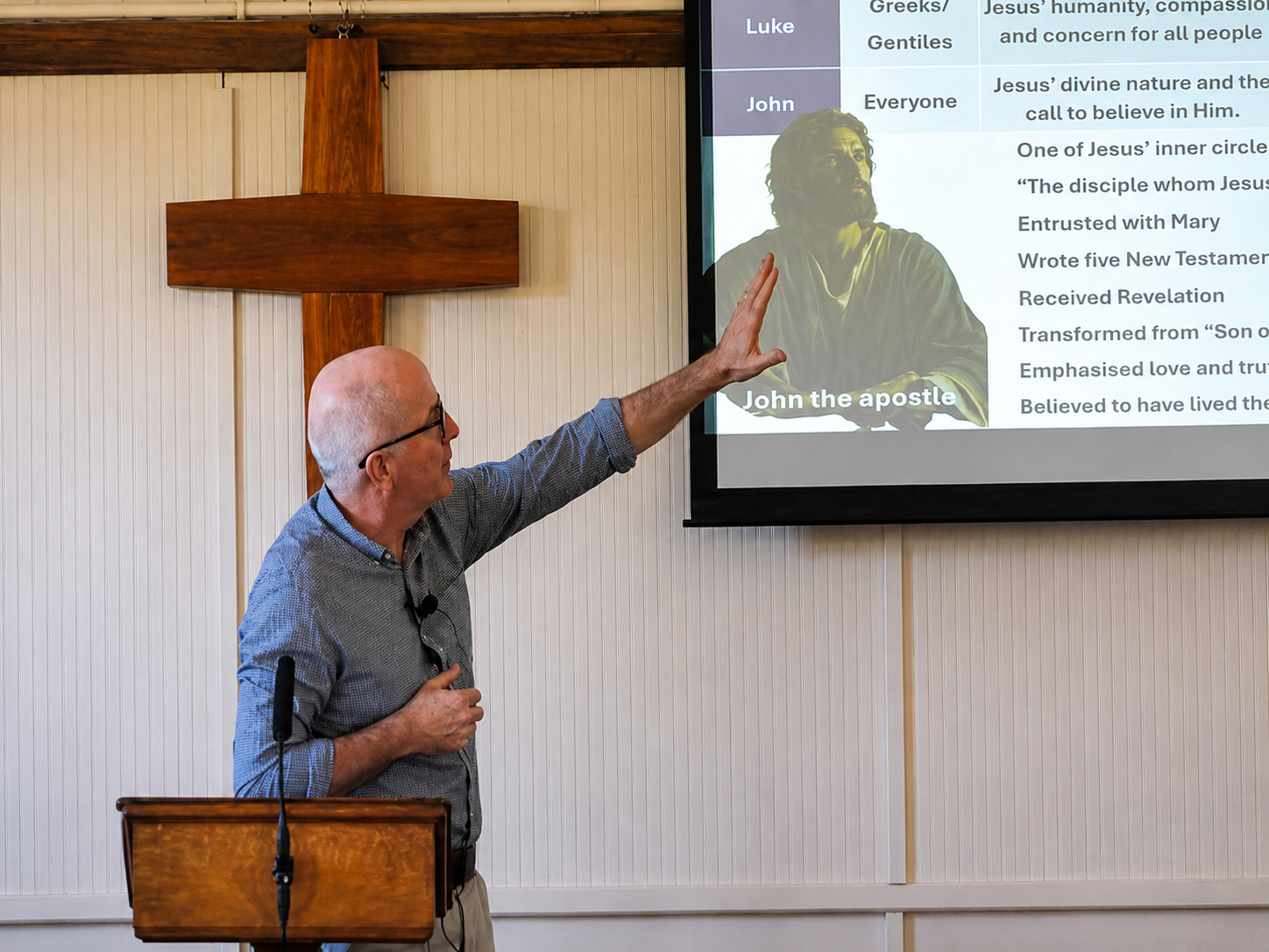 Man speaking at the front of Emmanuel Fellowship Church in Loxwood.