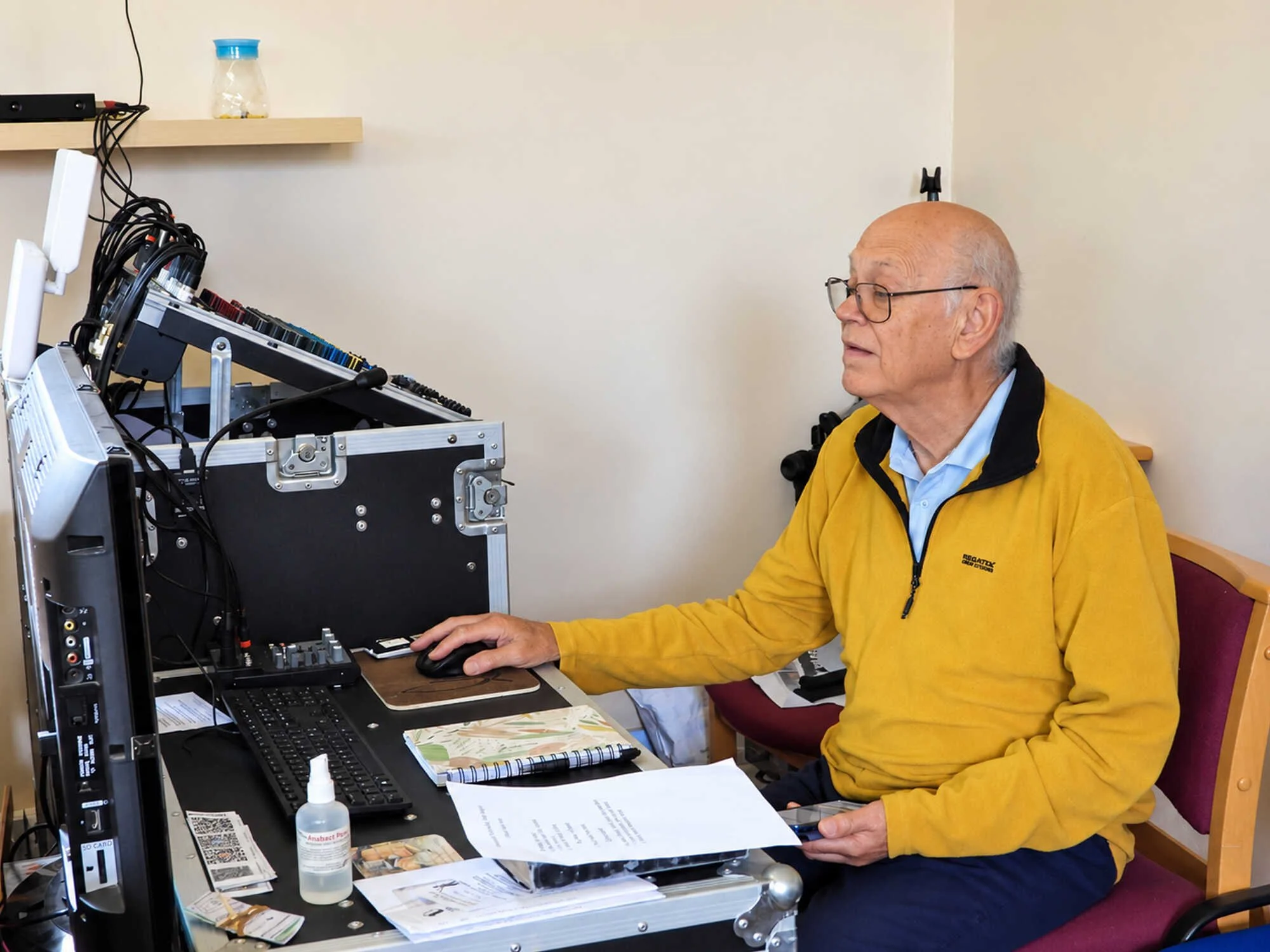 Derek Clark operating the audio visual equipment during a Sunday service