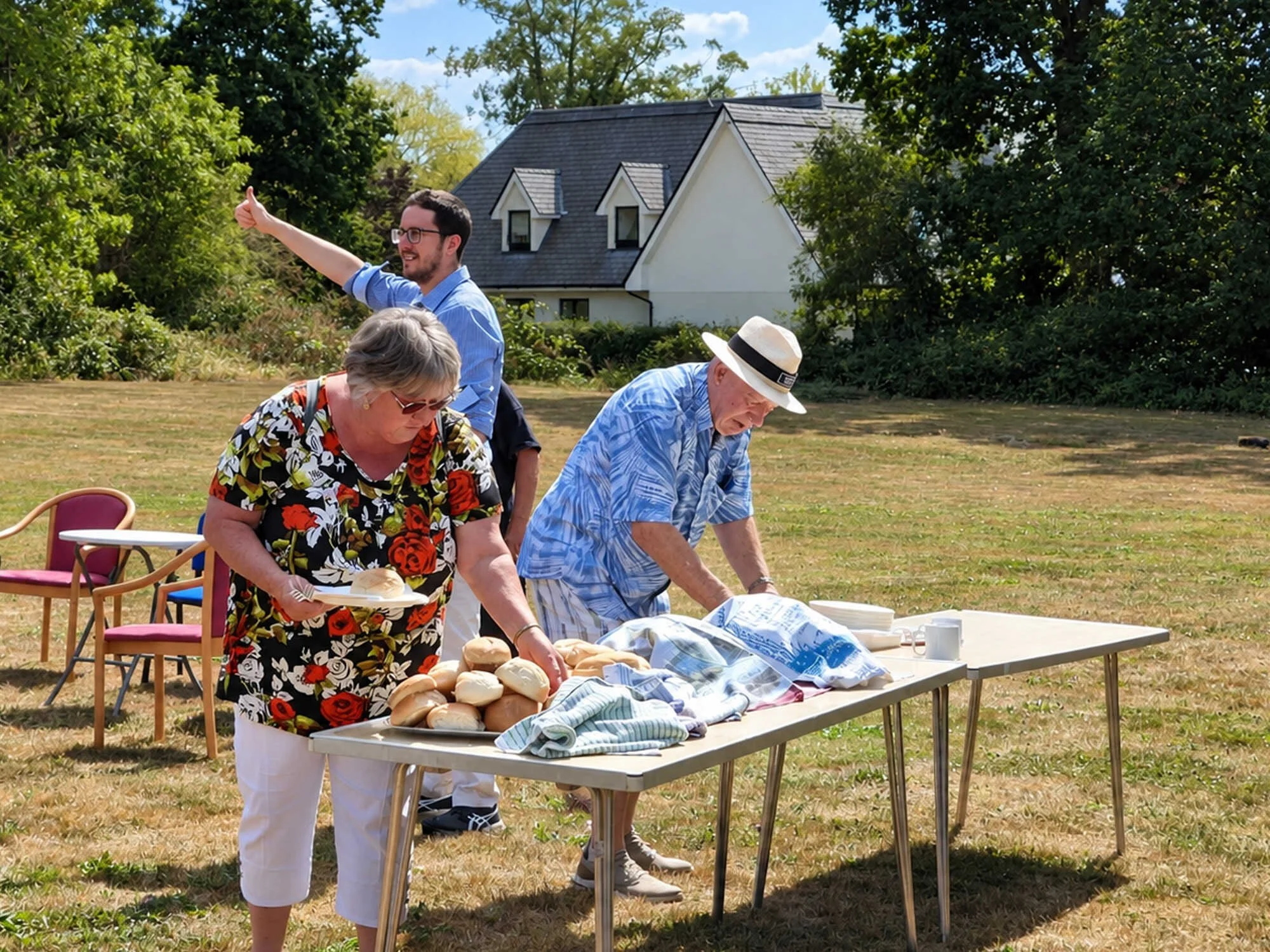 Members of Emmanuel Fellowship preparing food for a summer gathering