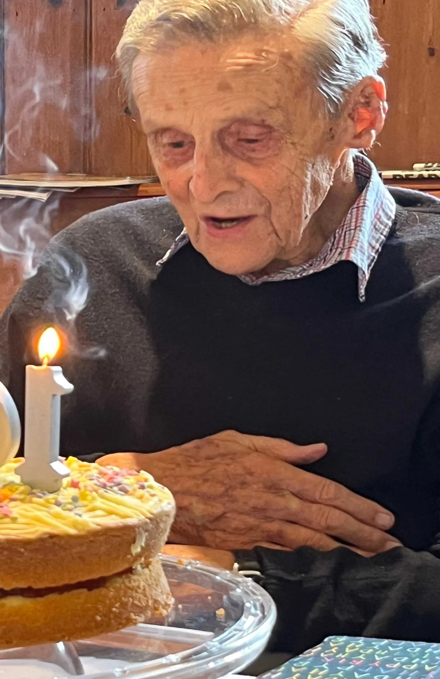 Emmanuel Fellowship member celebrating his 100th birthday with a birthday cake