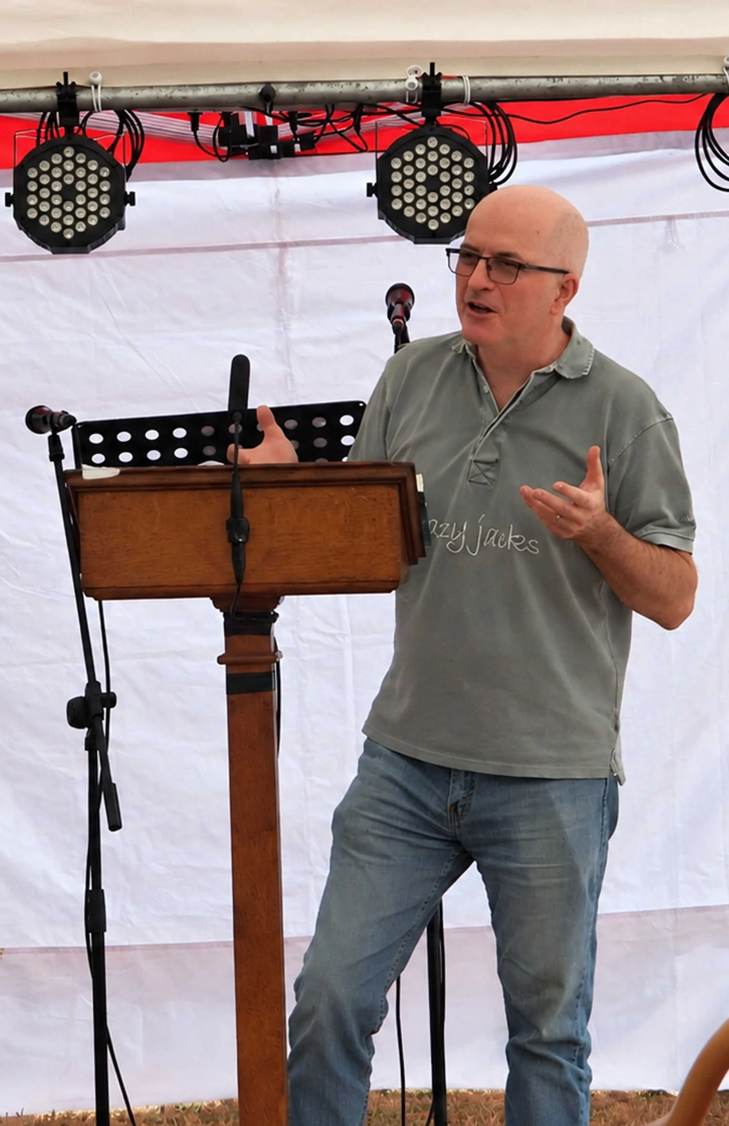 Steve Douglas speaking at an outdoor Emmanuel Fellowship service