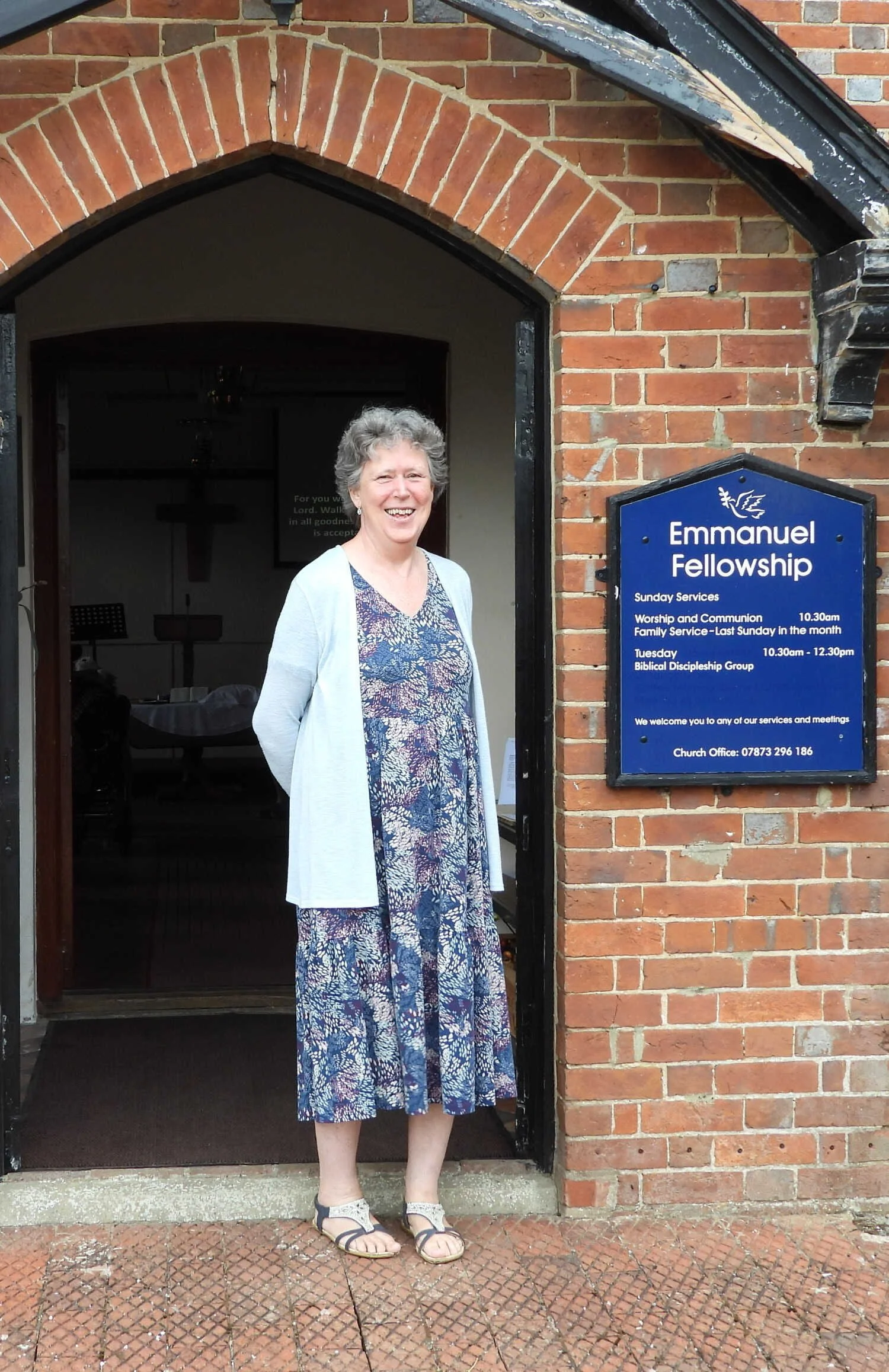 Emmanuel Fellowship member welcoming people outside the chapel in Loxwood