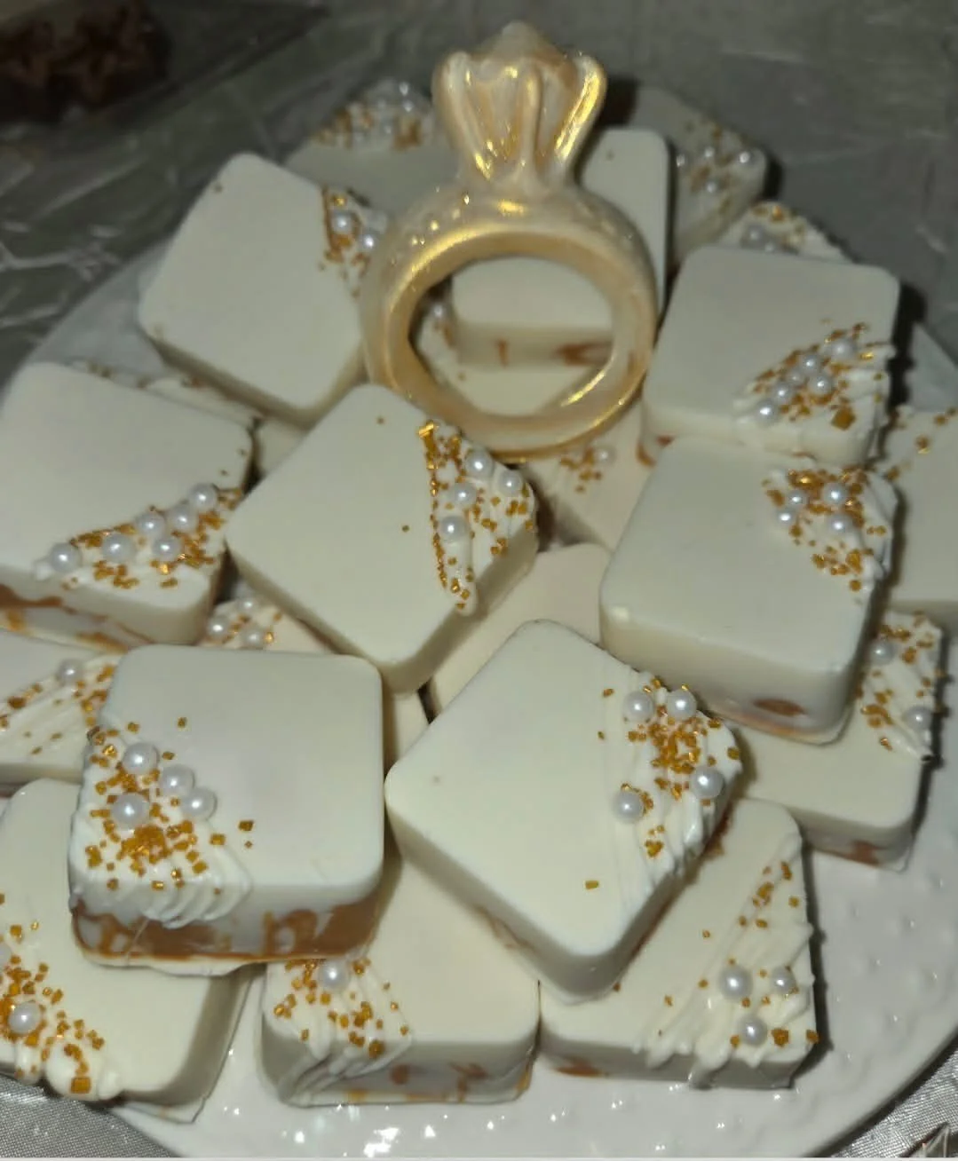Want your quote turned around fast? Here's the shortcut 👇

When you reach out for a custom order, include:
- your event date
- quantity needed
- color palette (gold and white, like these cake pops.
- any logo or mold ideas

The more details you send