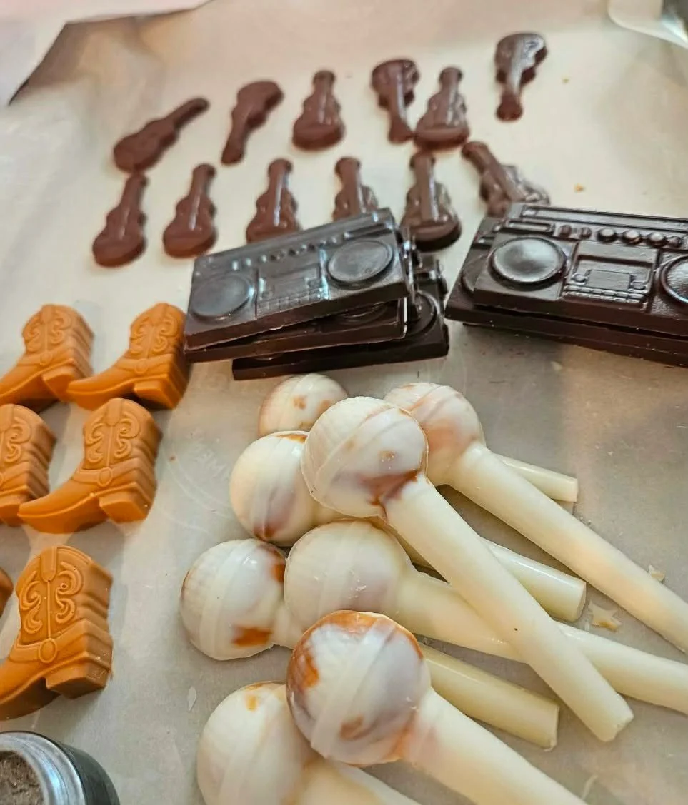 Put the whole band on the dessert table.

For a karaoke or musician&rsquo;s party, pair chocolate guitars, a boom box, microphones, and boots for a theme that carries through every treat. With plenty of flavors to choose from, the lineup can taste as