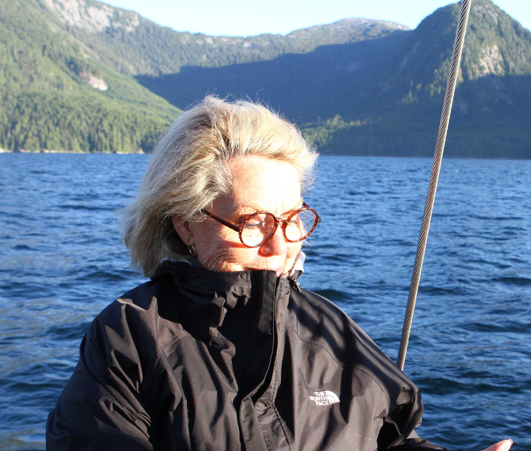Carole On Maple Leaf Sailing vesssel , Mountains of Great Bear in background, Queen Charlotte Strait, BC