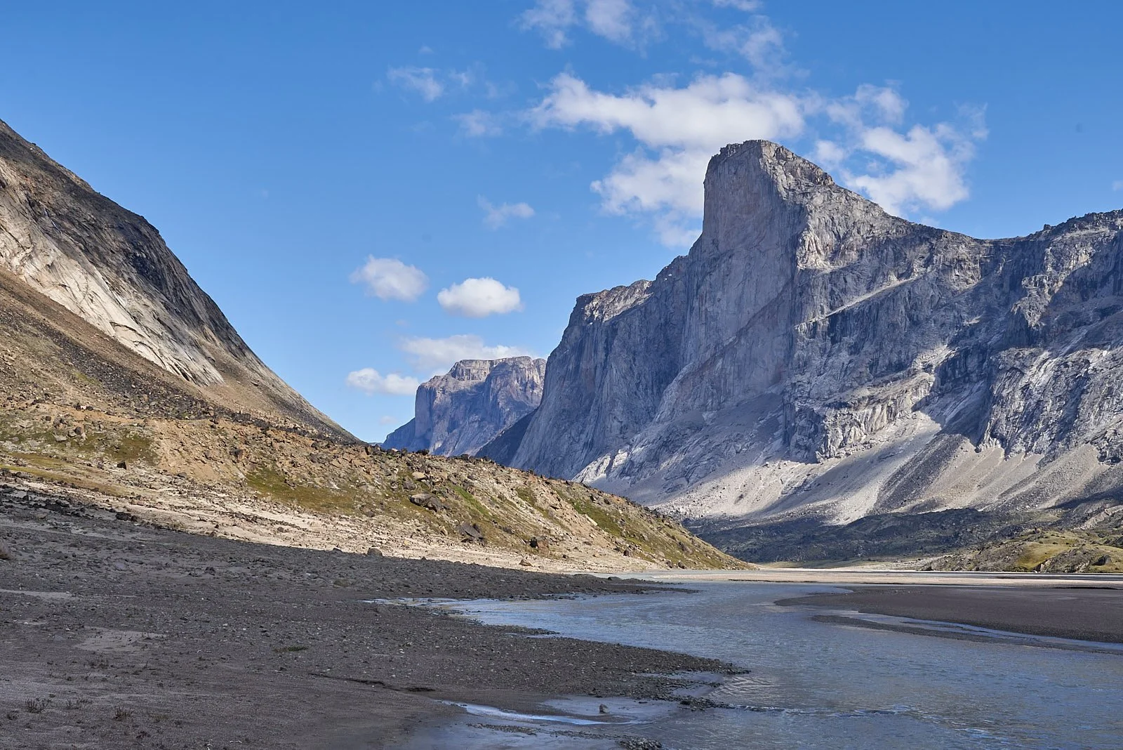 Hiking northeast through the Akshayuk Pass. Mt. Thor, right.