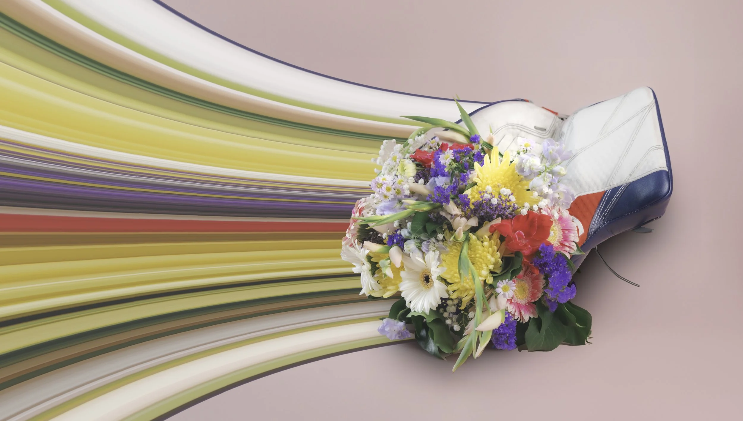 Colorful bouquet of assorted flowers resting in a goalie hockey glove with multicolored ribbons on a pink background.