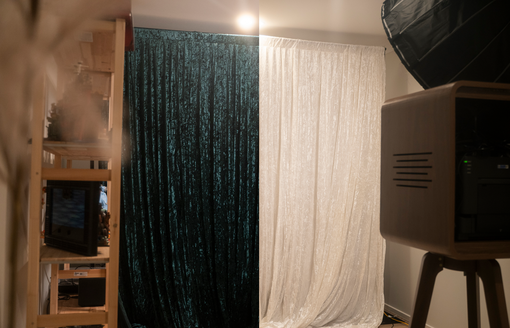 A room divided by two different curtains, with various electronic and wooden furniture visible on both sides. The left side features a dark, textured velvet curtain, and the right side features a light-colored, velvet curtain. The room includes a wooden bookshelf with electronic devices, a monitor, and a wooden cabinet on a stand.