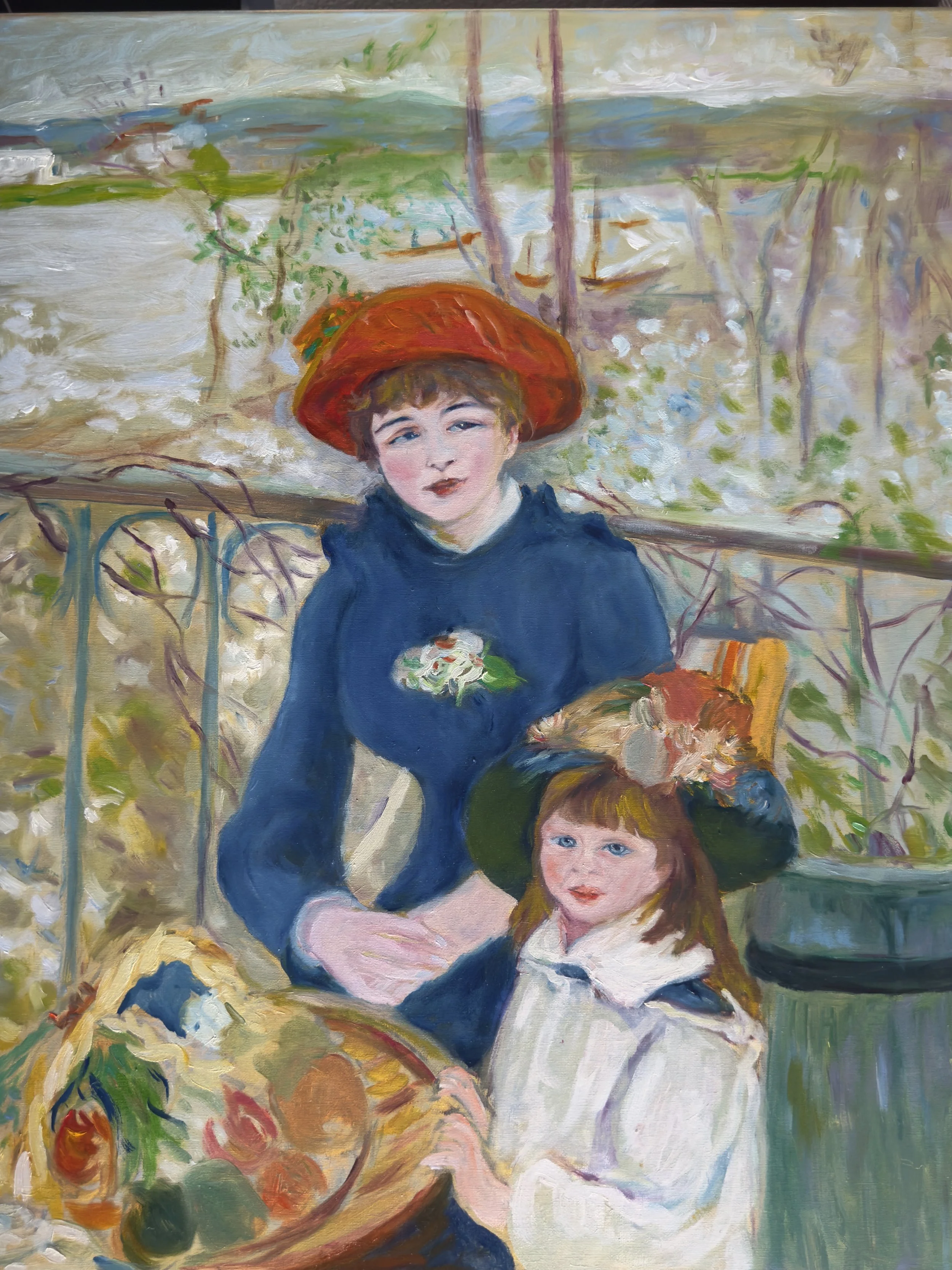 An impressionist painting of two children, a girl with red hair and a boy with brown hair, sitting outdoors. The girl is wearing a white dress, and the boy is wearing a dark suit and a green hat. The background depicts a landscape with trees, a body 