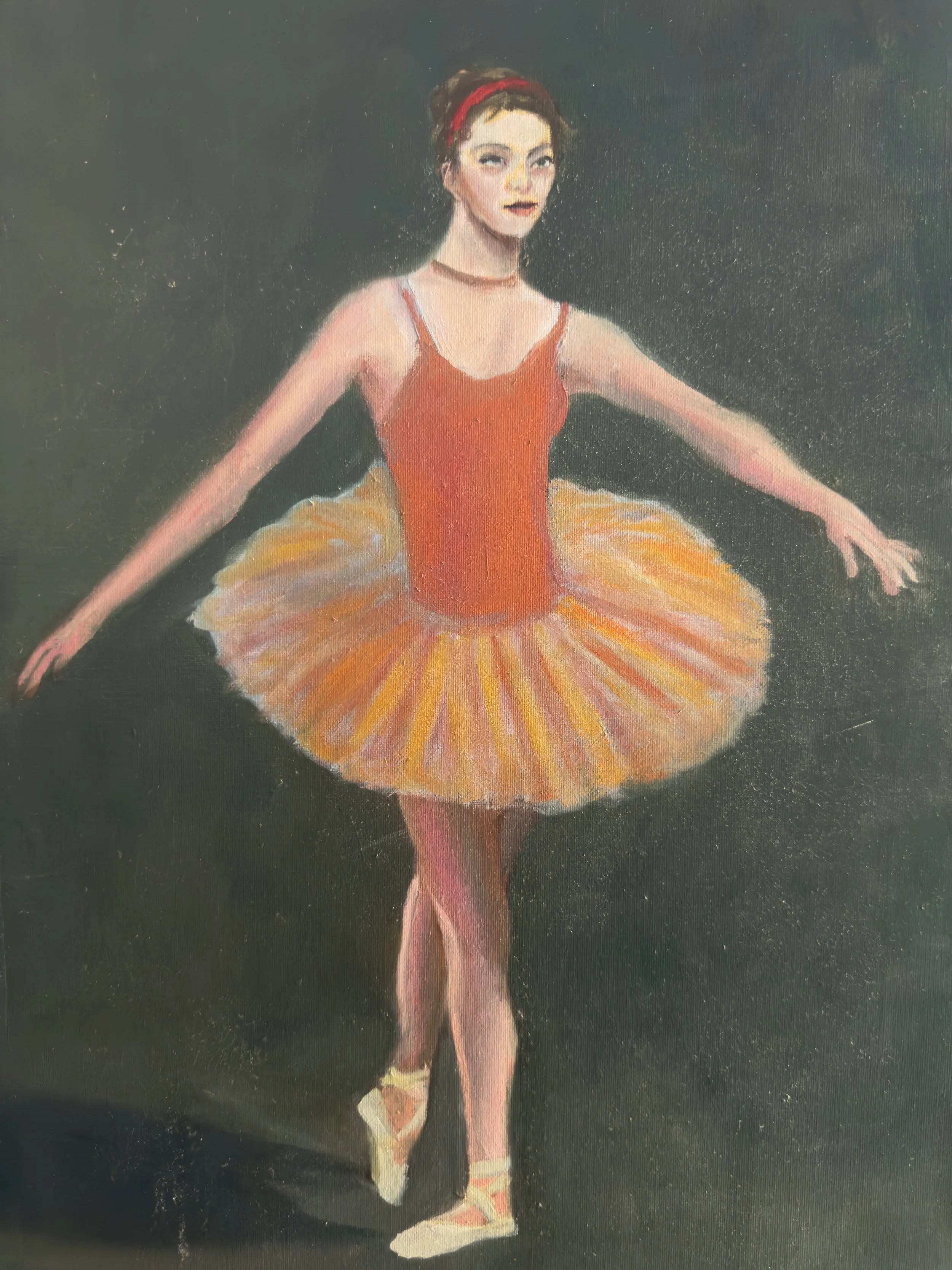 A painting of a ballerina in a pink tutu with yellow accents, standing on one leg with arms extended, set against a dark background.