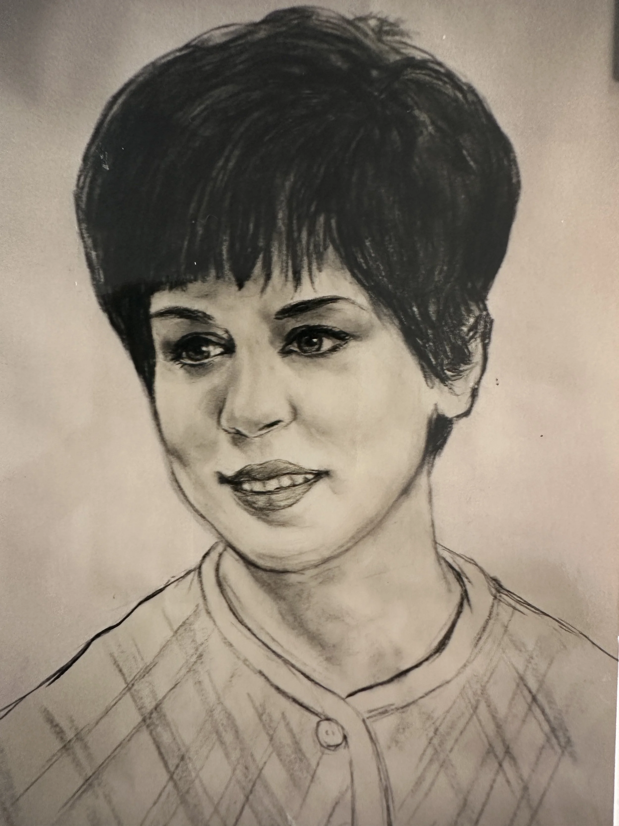 A black and white portrait drawing of a woman with short hair, wearing a blouse with a round collar and button.