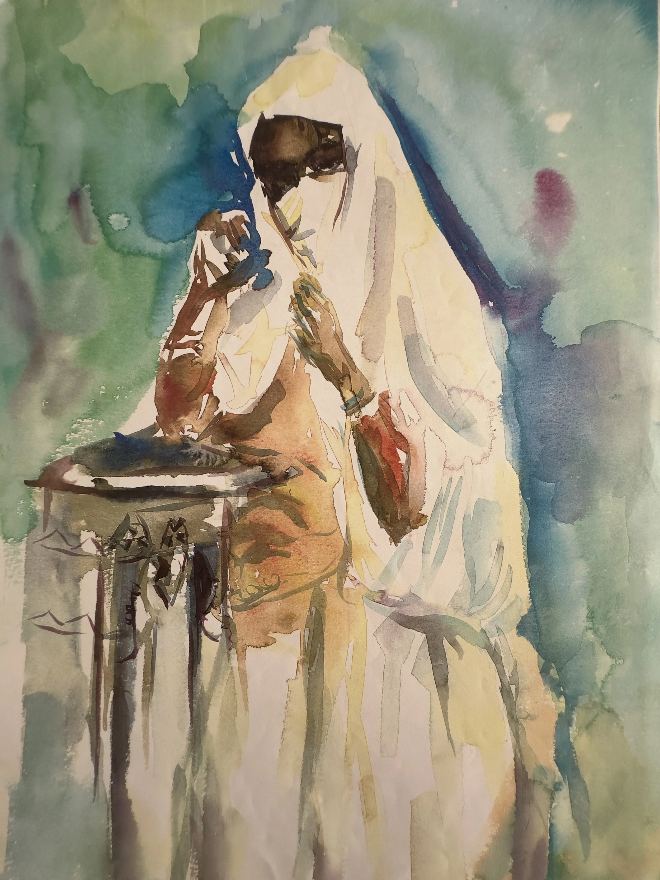 A watercolor painting of a person with dark skin and short hair, sitting next to a table with a cup, with a background of green, blue, and yellow hues.