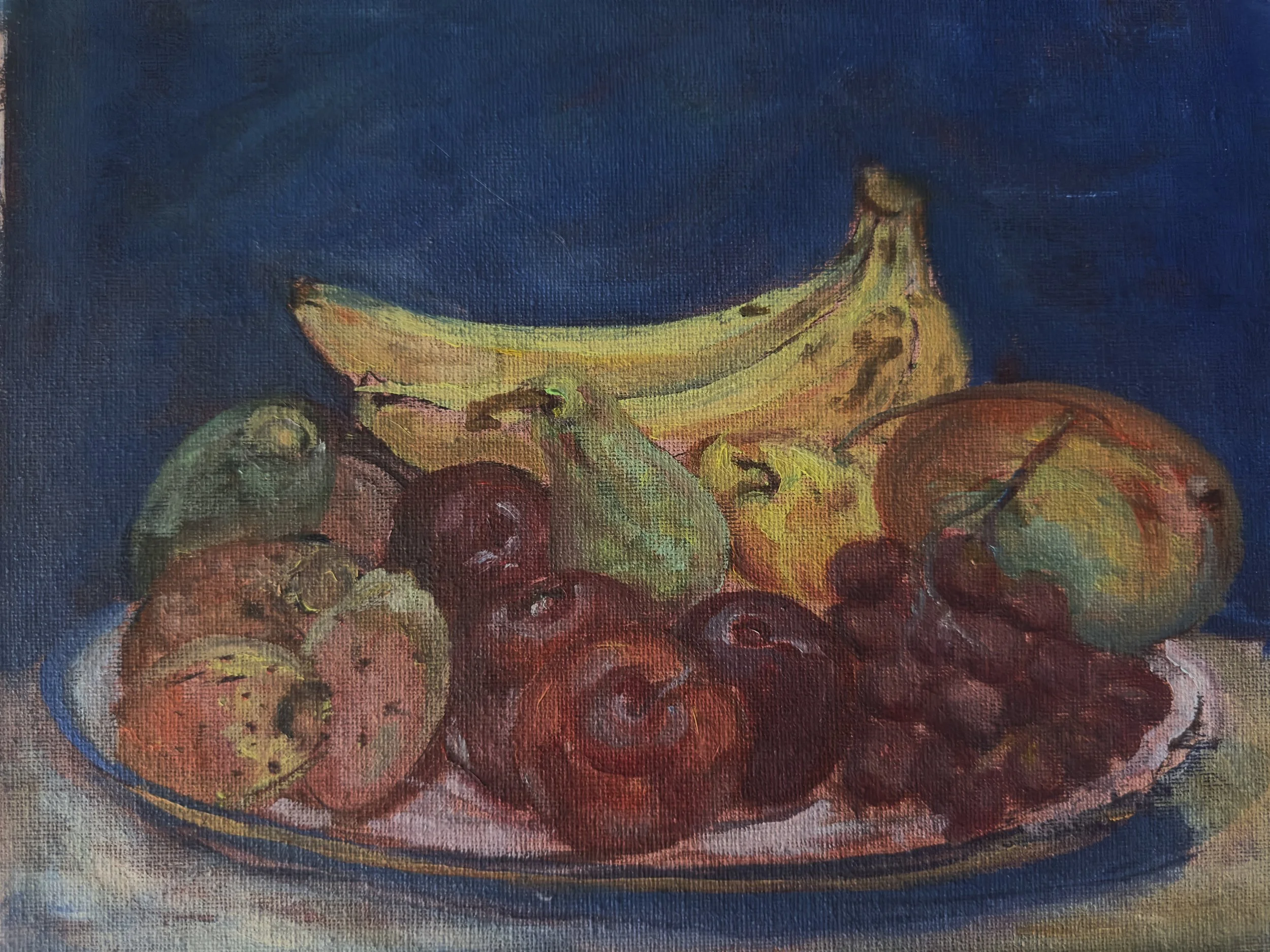 A still life painting of a bowl filled with bananas, grapes, apples, and other fruits, set against a dark blue background.