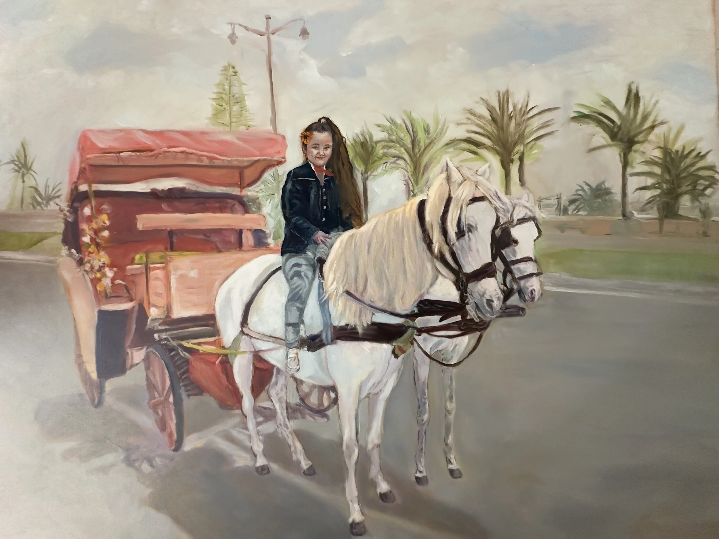 A mural depicting a young girl with long hair, wearing a jacket, riding a white horse. The horse is pulling a pink carriage with floral decorations, set against a background of trees and power lines.