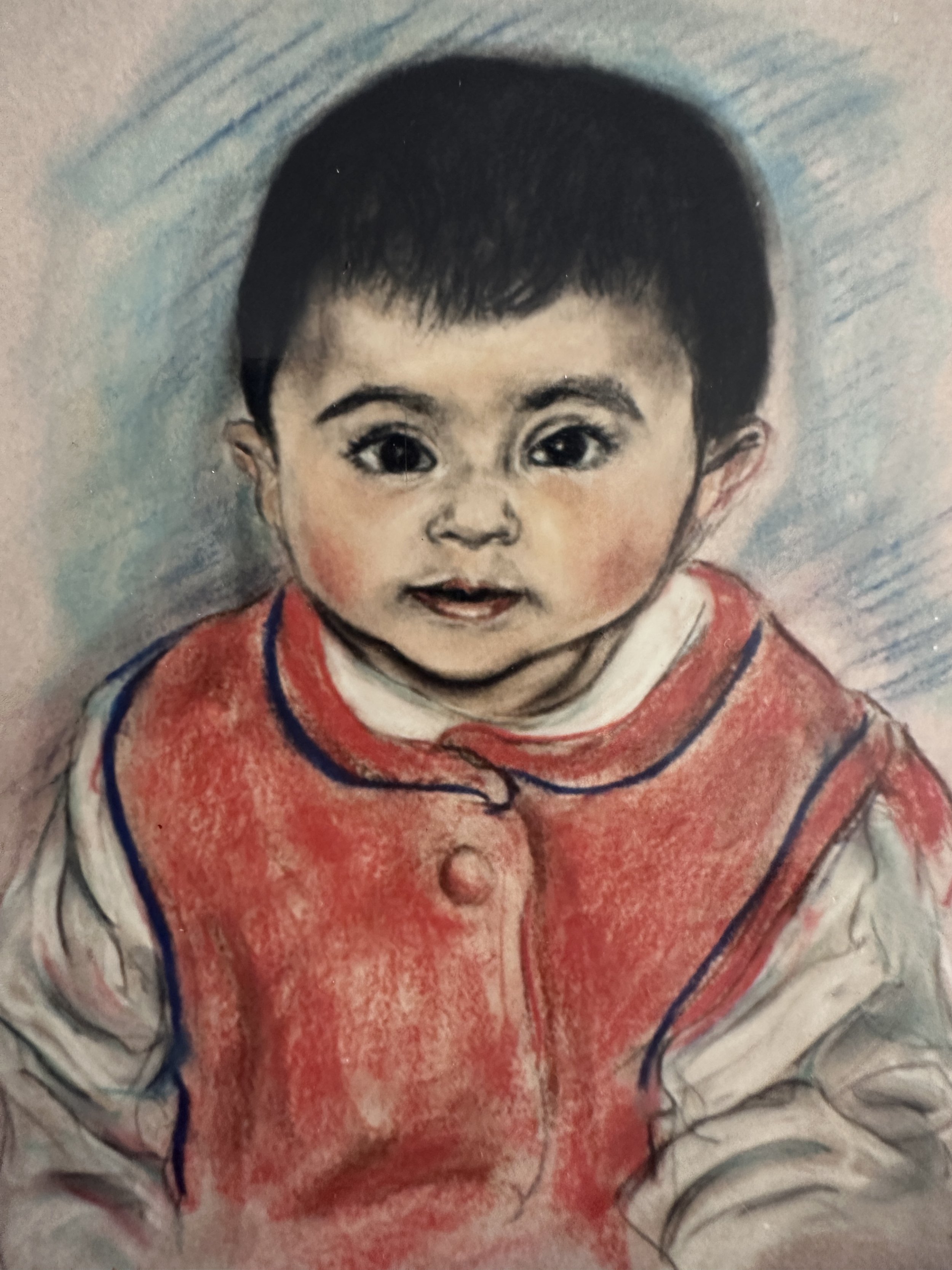 A drawing of a young child with short black hair, large eyes, and a gentle smile, wearing a red vest over a white shirt with gray sleeves, set against a textured, light-colored background.