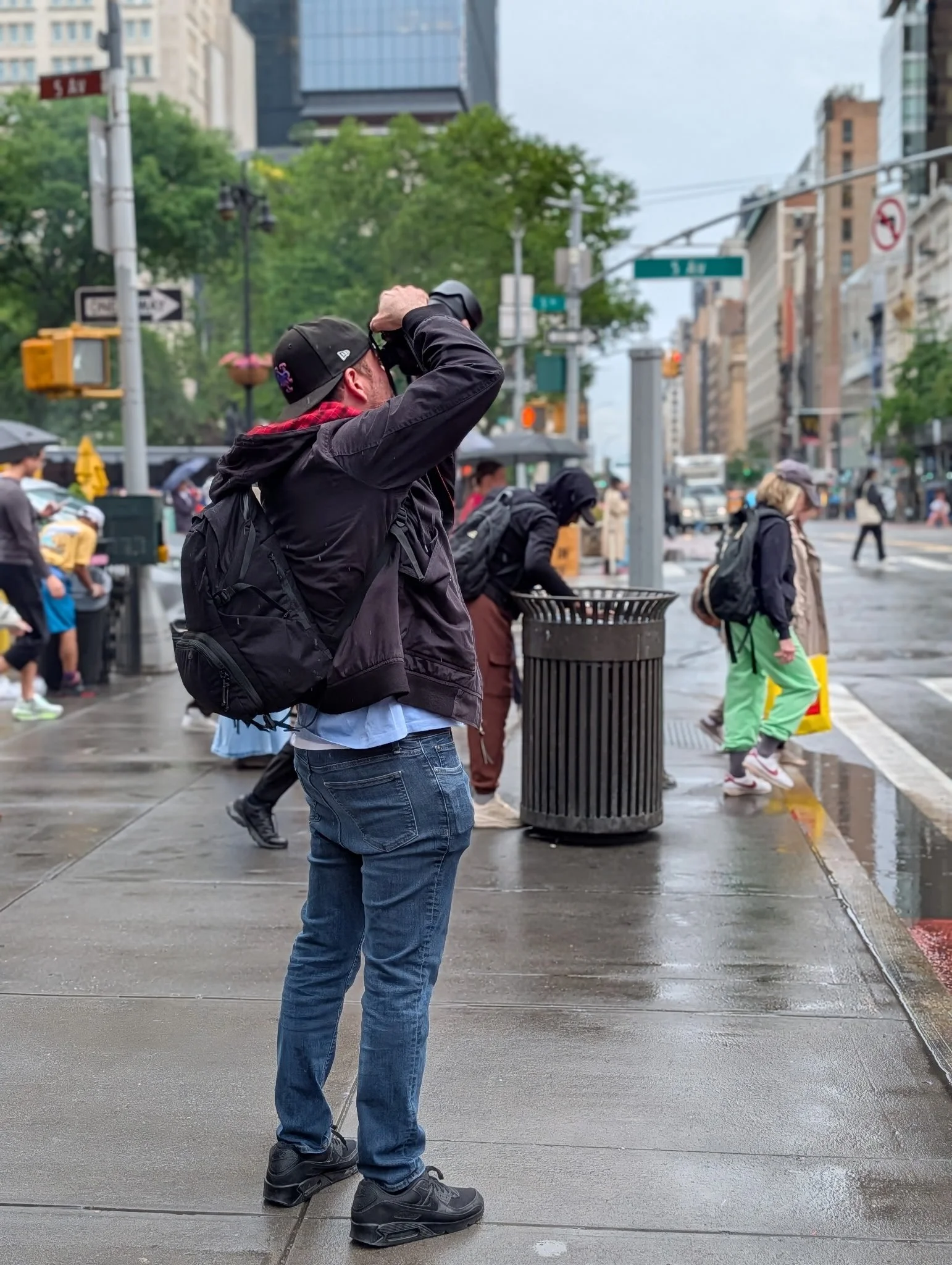Street portrait of a man in New York City on a rainy day.