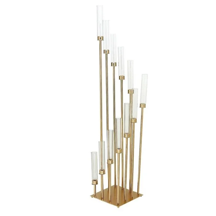 Gold 12 arm candelabra with multiple taper candle holders of varying heights enclosed in glass