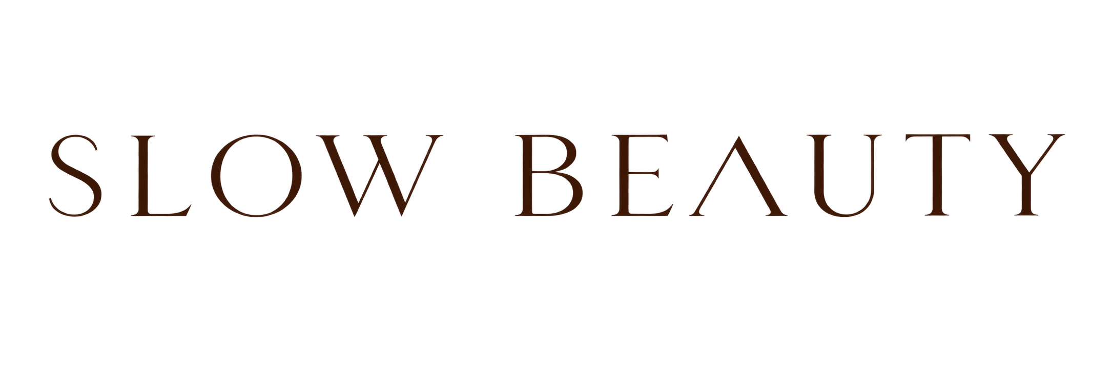 Logotipo con texto que dice 'SLOW BEAUTY' en letras grandes y elegantes.