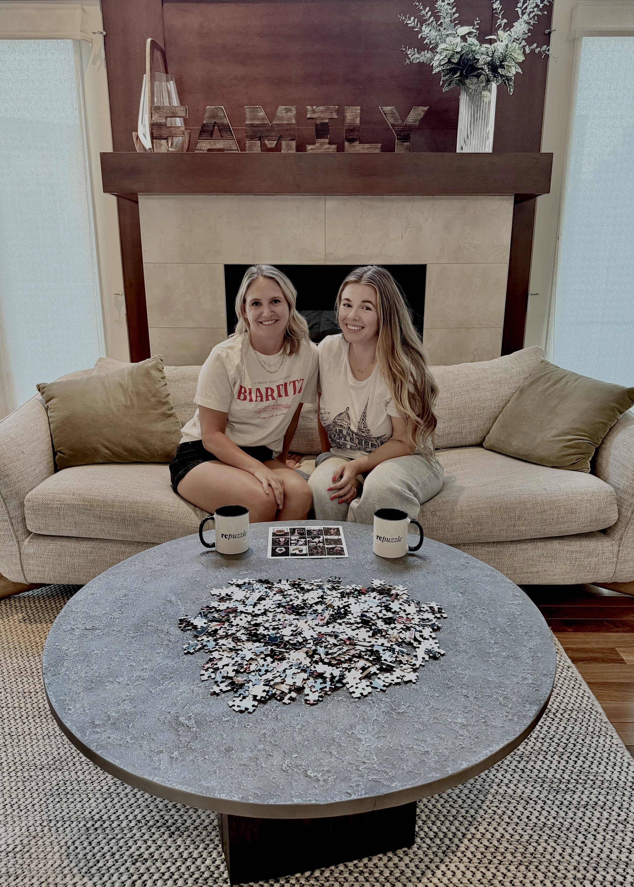 2 founders sitting on the couch with a puzzle