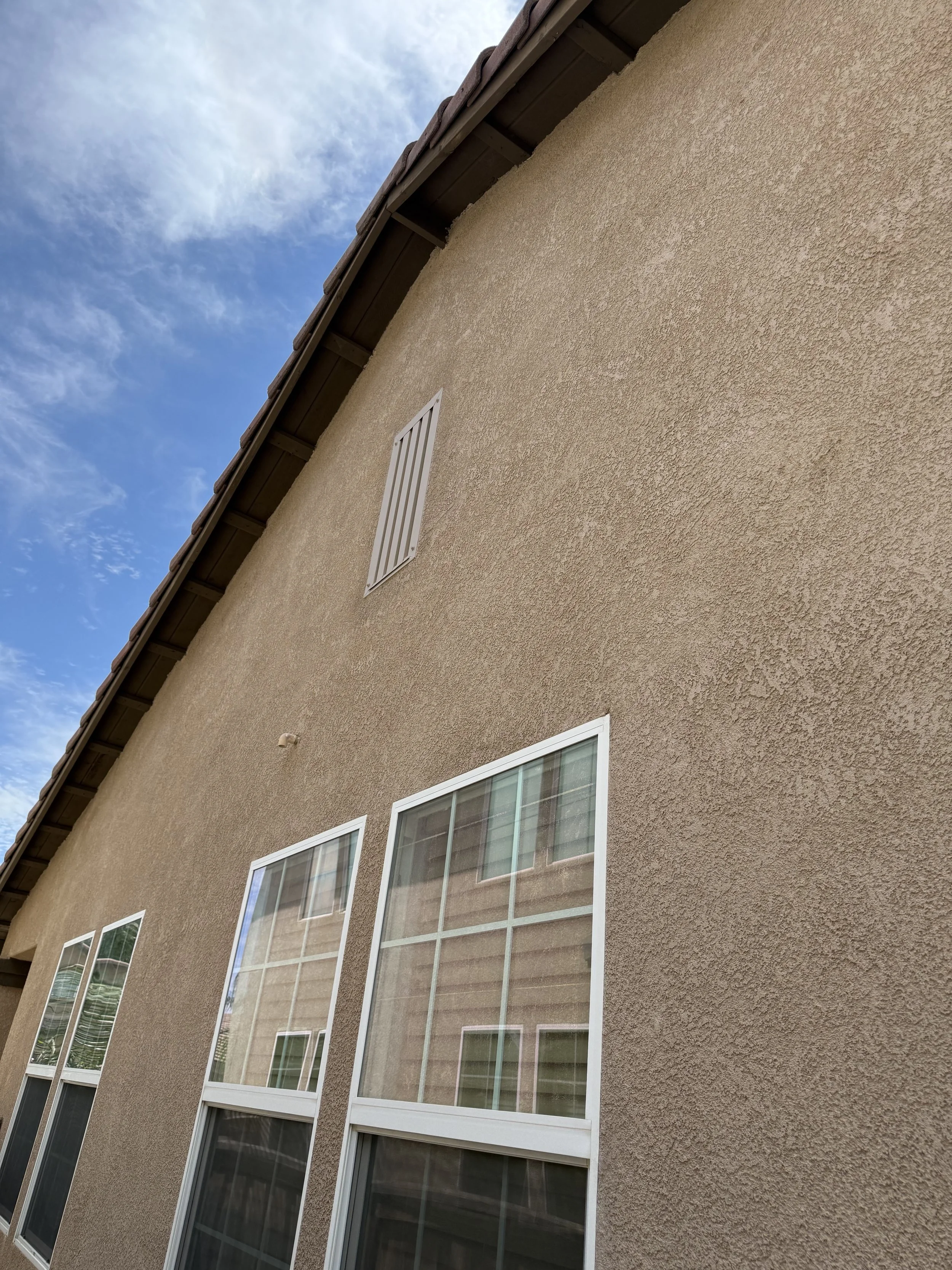 Image of a BrandGuard ember resistant gable vent that has been painted to match the home's exterior by EmberShield Systems