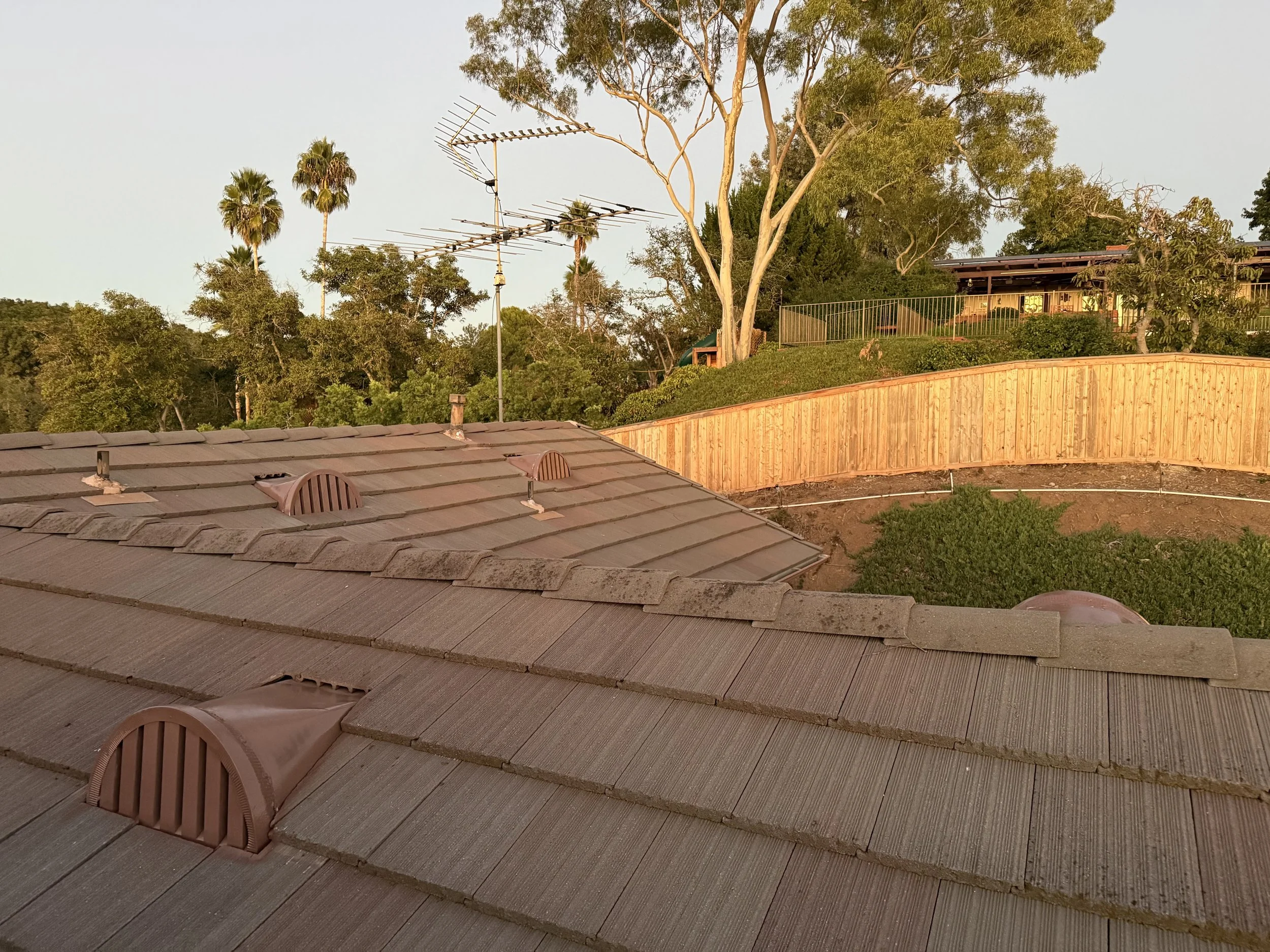 Image of a roof with 3 BrandGuard ember resistant retrofit dormer vents installed by EmberShield Systems