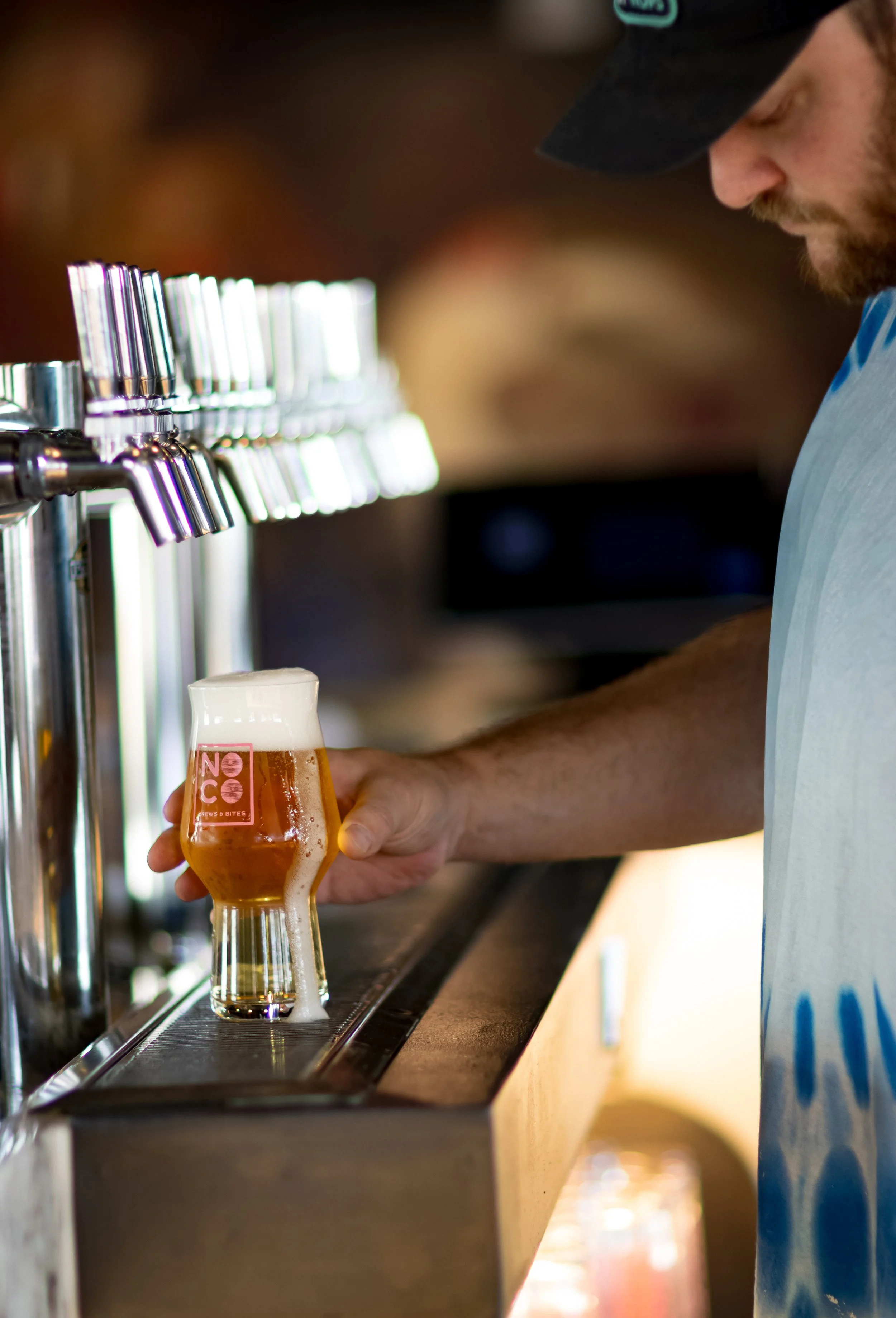 Pouring a fresh NOCO beer at the tap