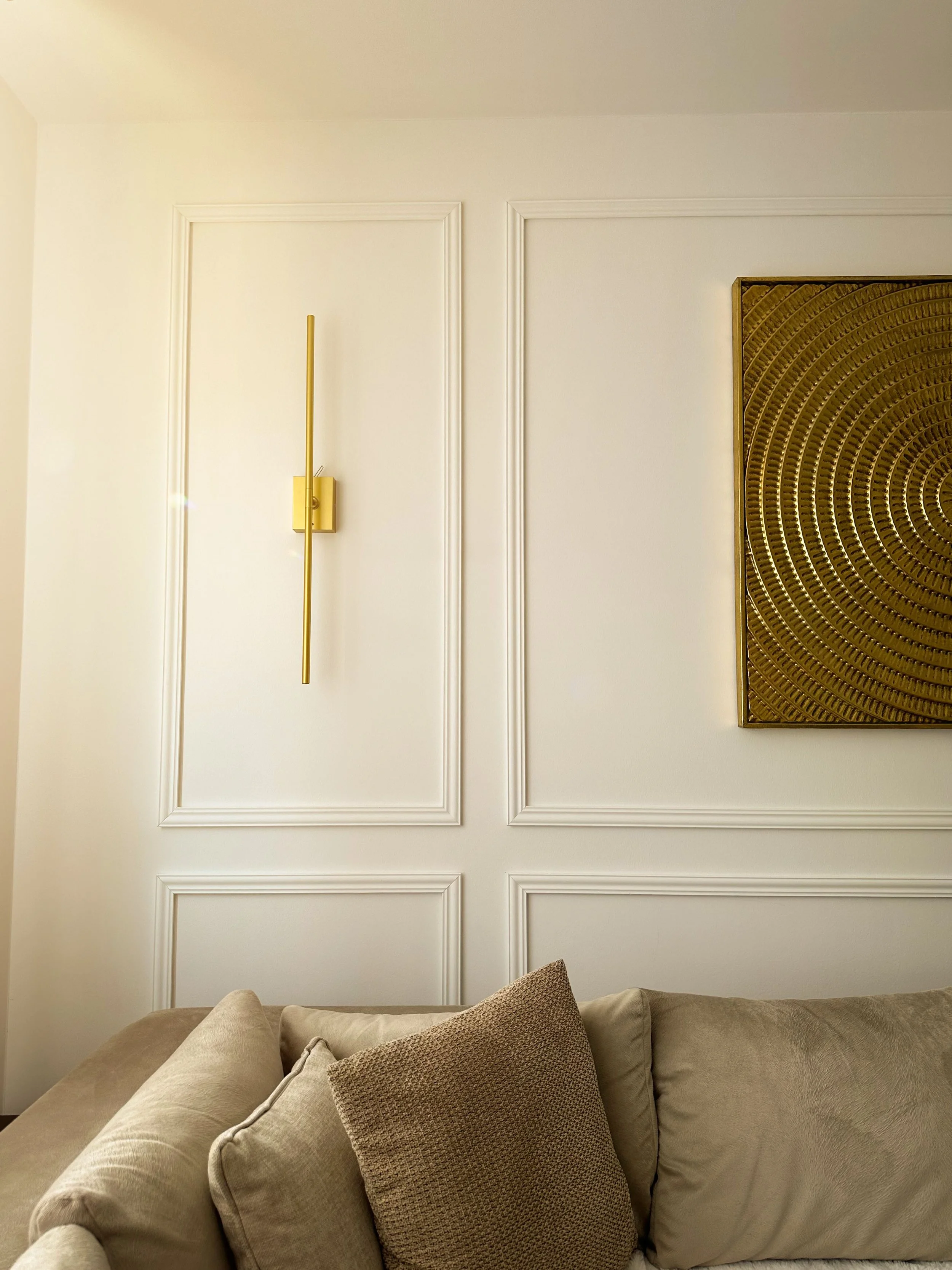 Flawless custom white wainscoting and intricate wall paneling in a bright home office, highlighting high-end interior millwork and trim painting in Clayton, MO.