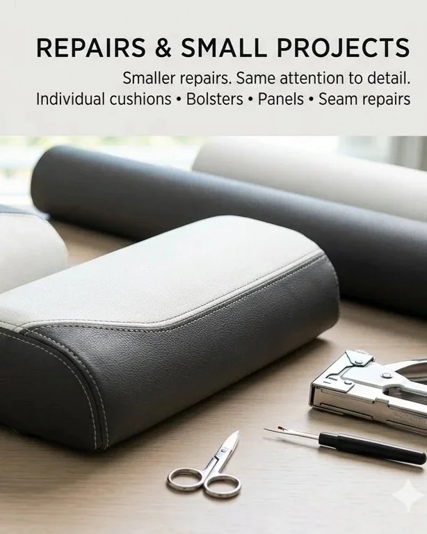 A workspace with furniture upholstery repair tools, including a synthetic leather cushion, fabric rolls, scissors, stapler, seam ripper, and a small screwdriver, for small furniture repairs and upholstery projects.