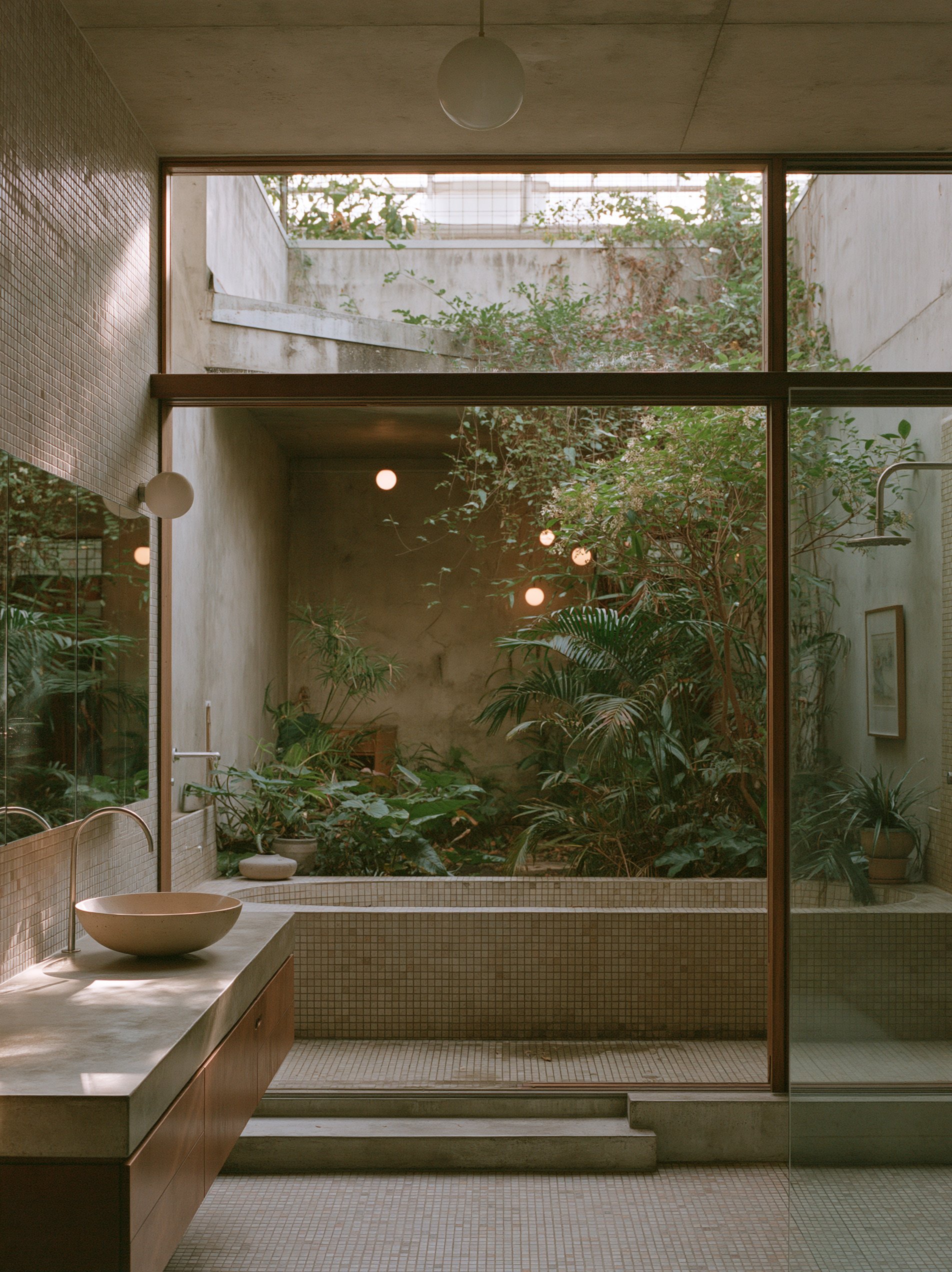 Nocturne House bathroom concept with timber cabinetry, mosaic tiles and a planted courtyard outlook, by HAJA Office for Architecture.