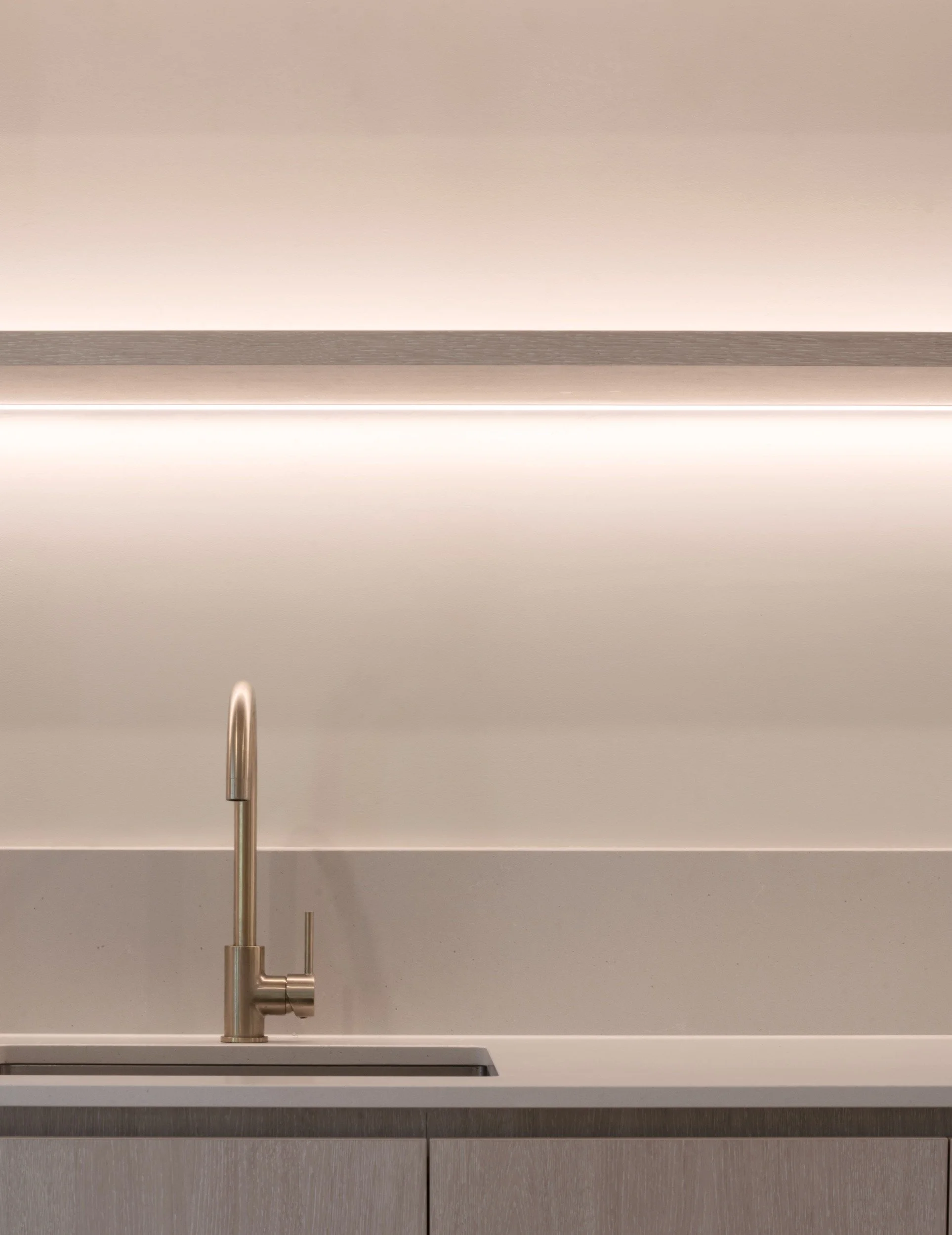 Springwood house kitchen sink with brass tap and concealed lighting.jpg