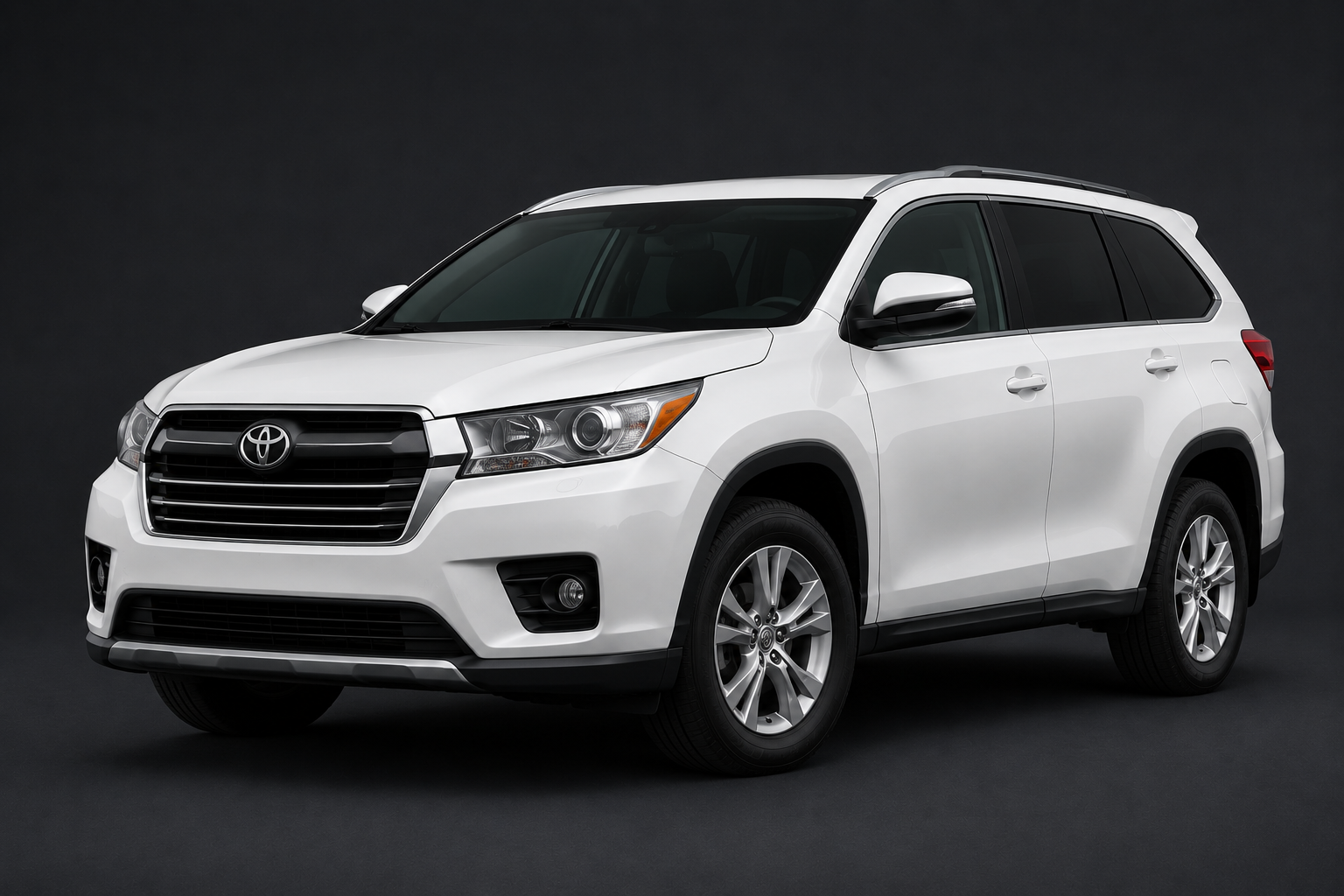 White Toyota SUV parked against a dark background.