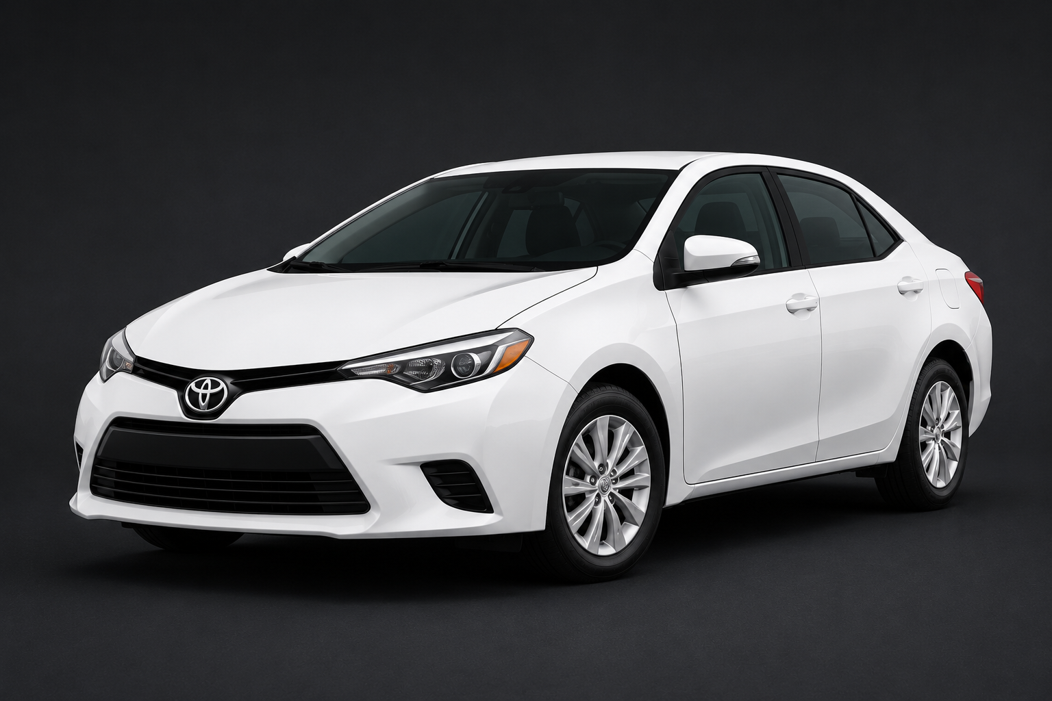 White Toyota sedan on a dark background