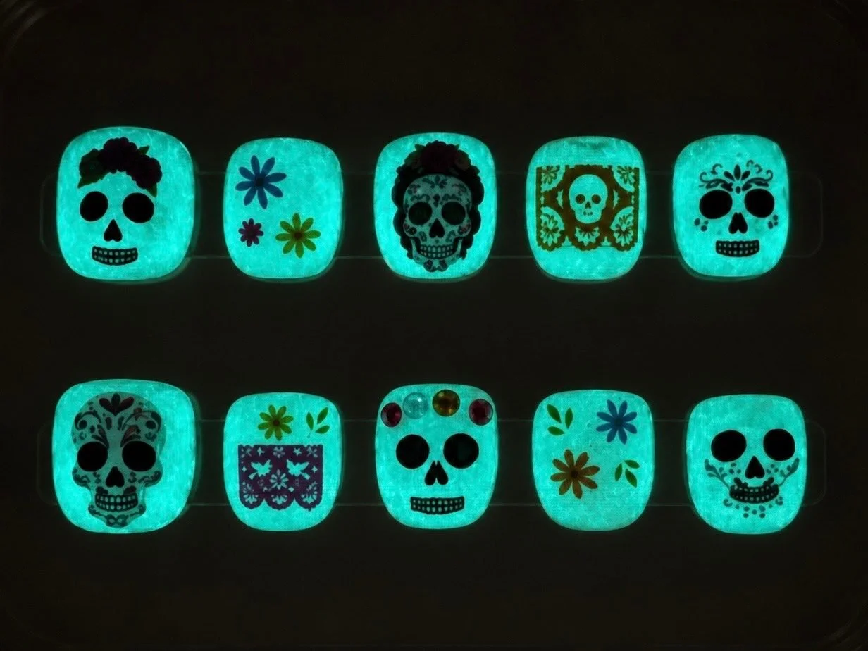The same Día de los Muertos kids' set glowing aqua in the dark.