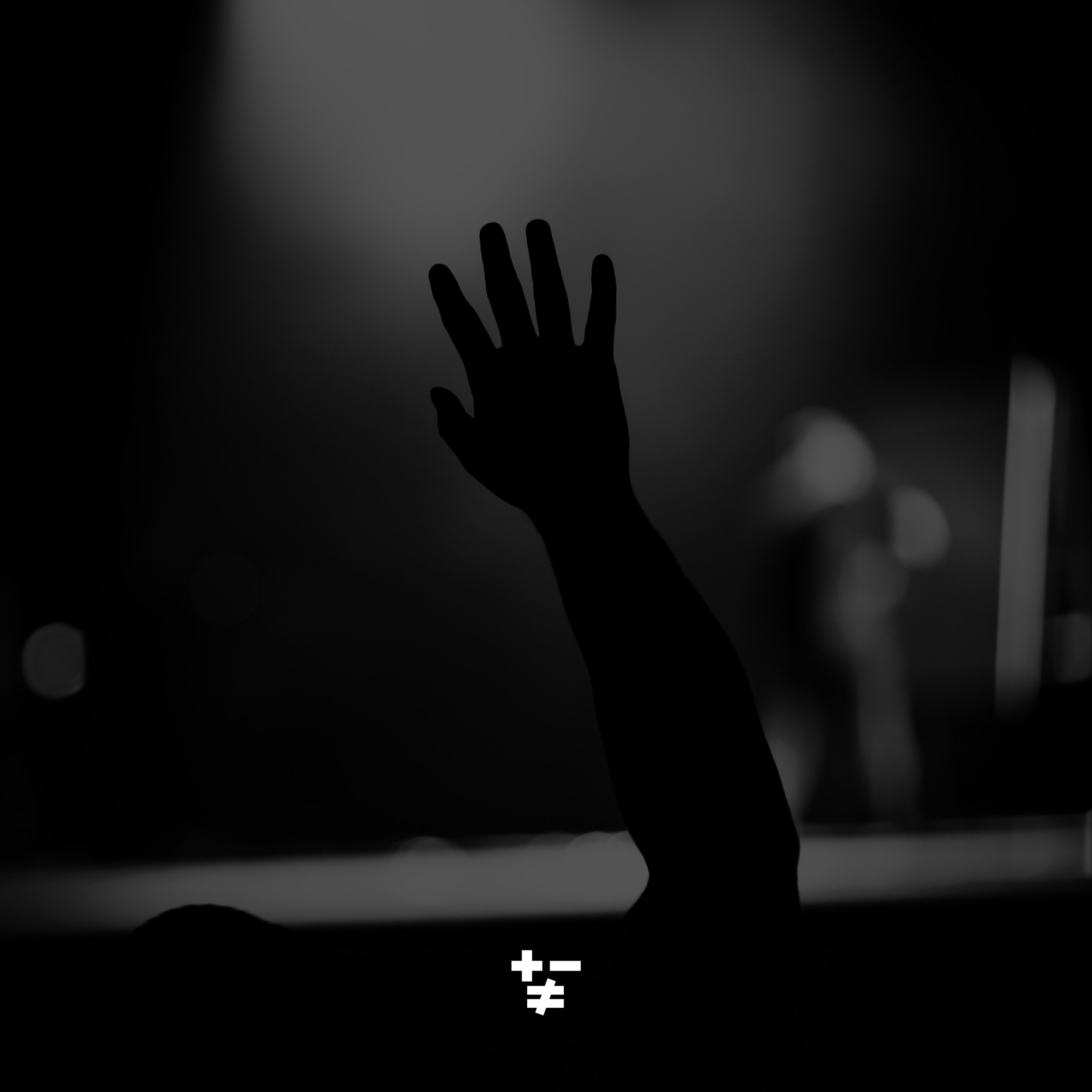 Silhouette of a hand reaching out on a dark background with symbols and a plus sign at the bottom.