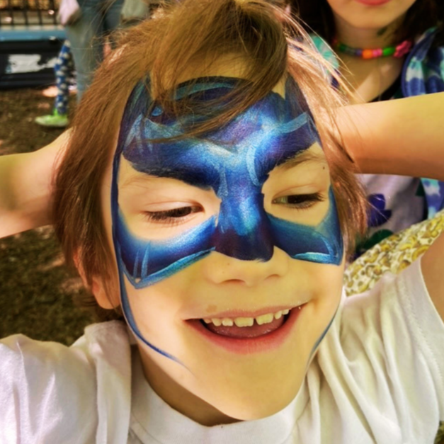 Child with batman face paint