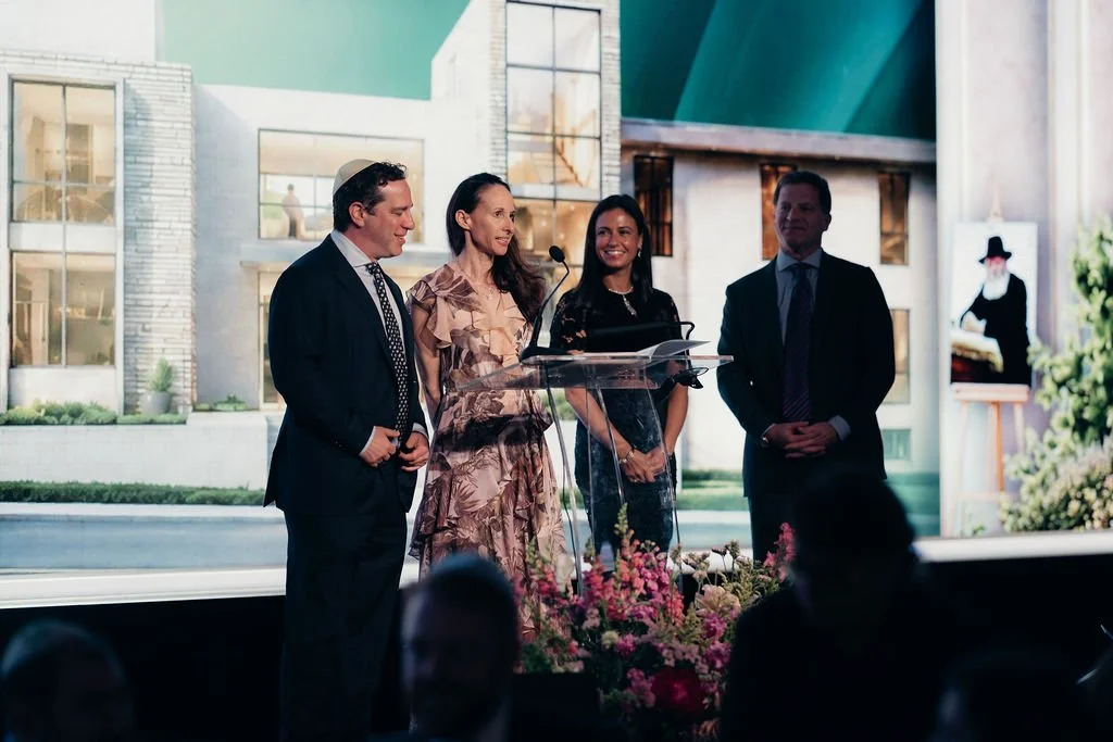 Honorees stand at the podium during the award presentation at the Chabad Chestnut Hill gala