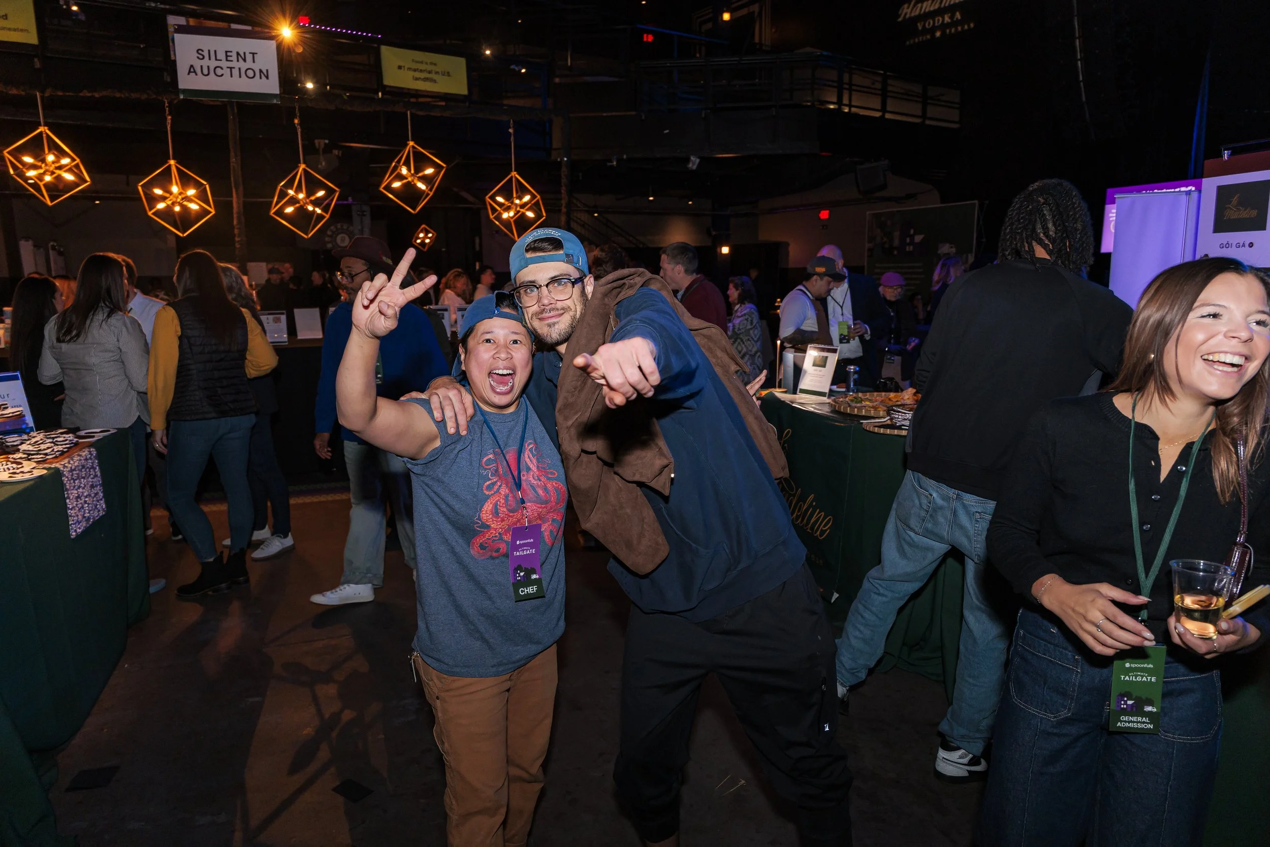 Guests ham it up for the camera on the event floor at the Spoonfuls Ultimate Tailgate