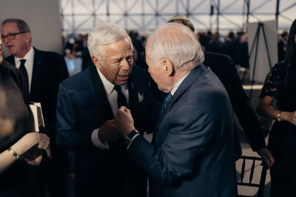 Guests greet each other warmly during the cocktail reception in the glass atrium