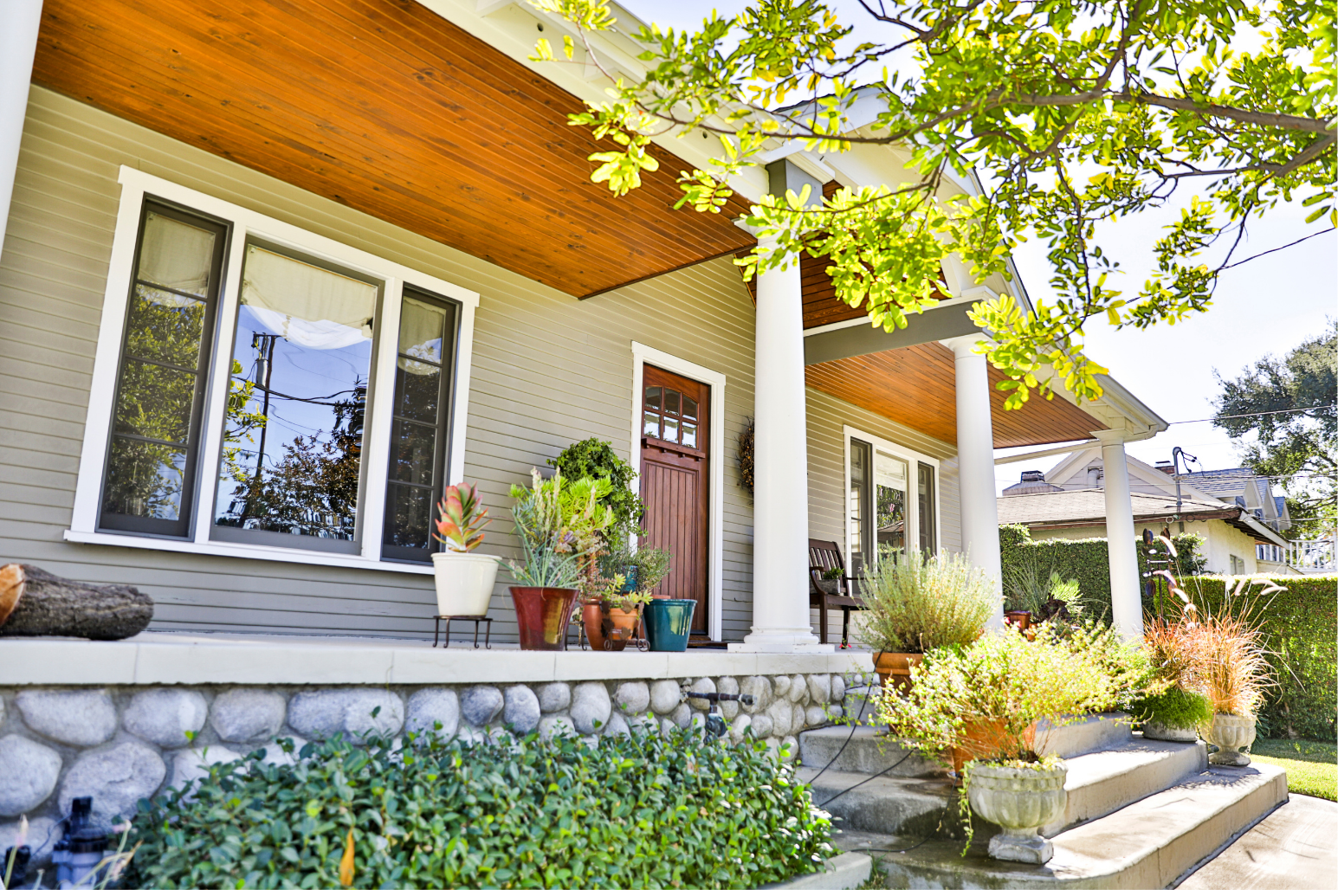 Craftsman-style home exterior with covered front porch, an Order & Grace service area in Toledo, Ohio