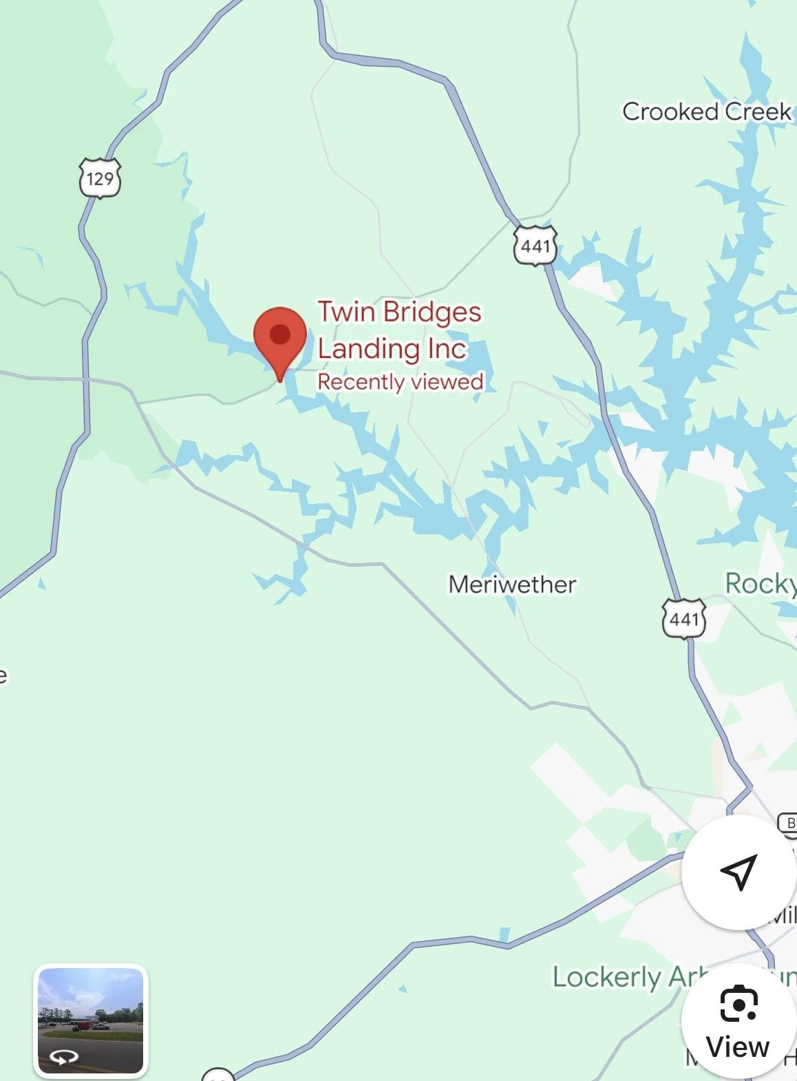 Map showing the location of Twin Bridges Landing Inc near a lake with surrounding roads and nearby towns.
