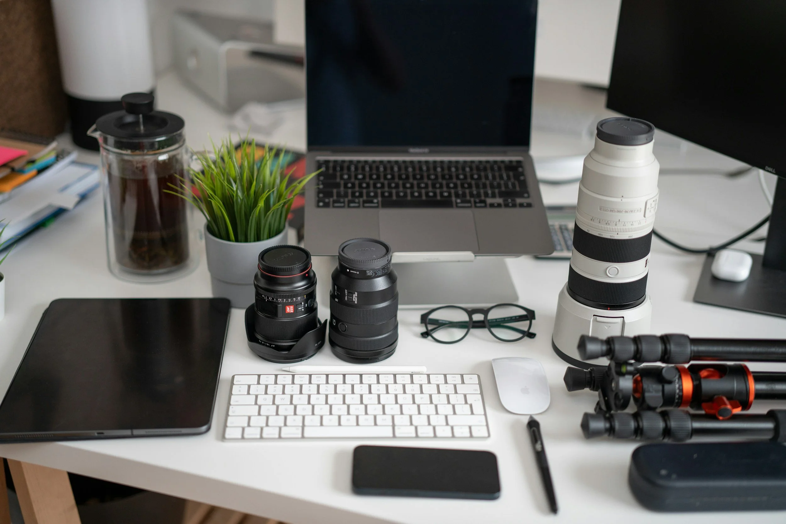 Creative workspace with camera equipment and a laptop representing RMG’s marketing and media production services.