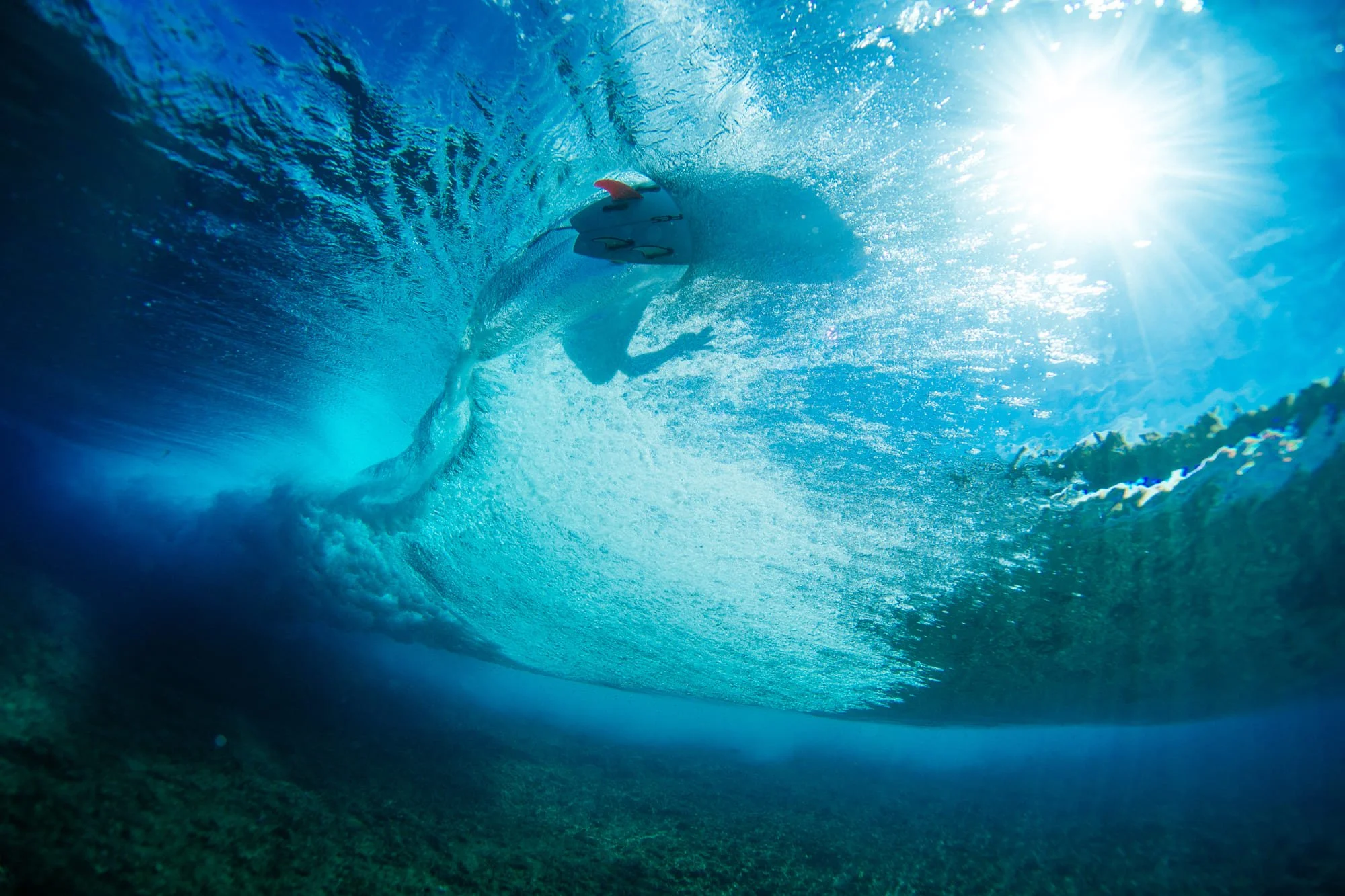 An underwater view of a wave breaking near Tanah Mympi.