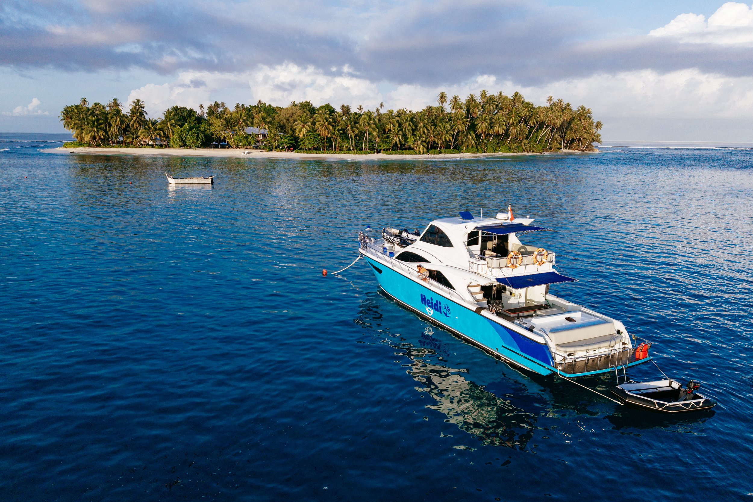 An aerial view of Heidi, Tanah Mympi's 53-foot yacht, moving through open water.