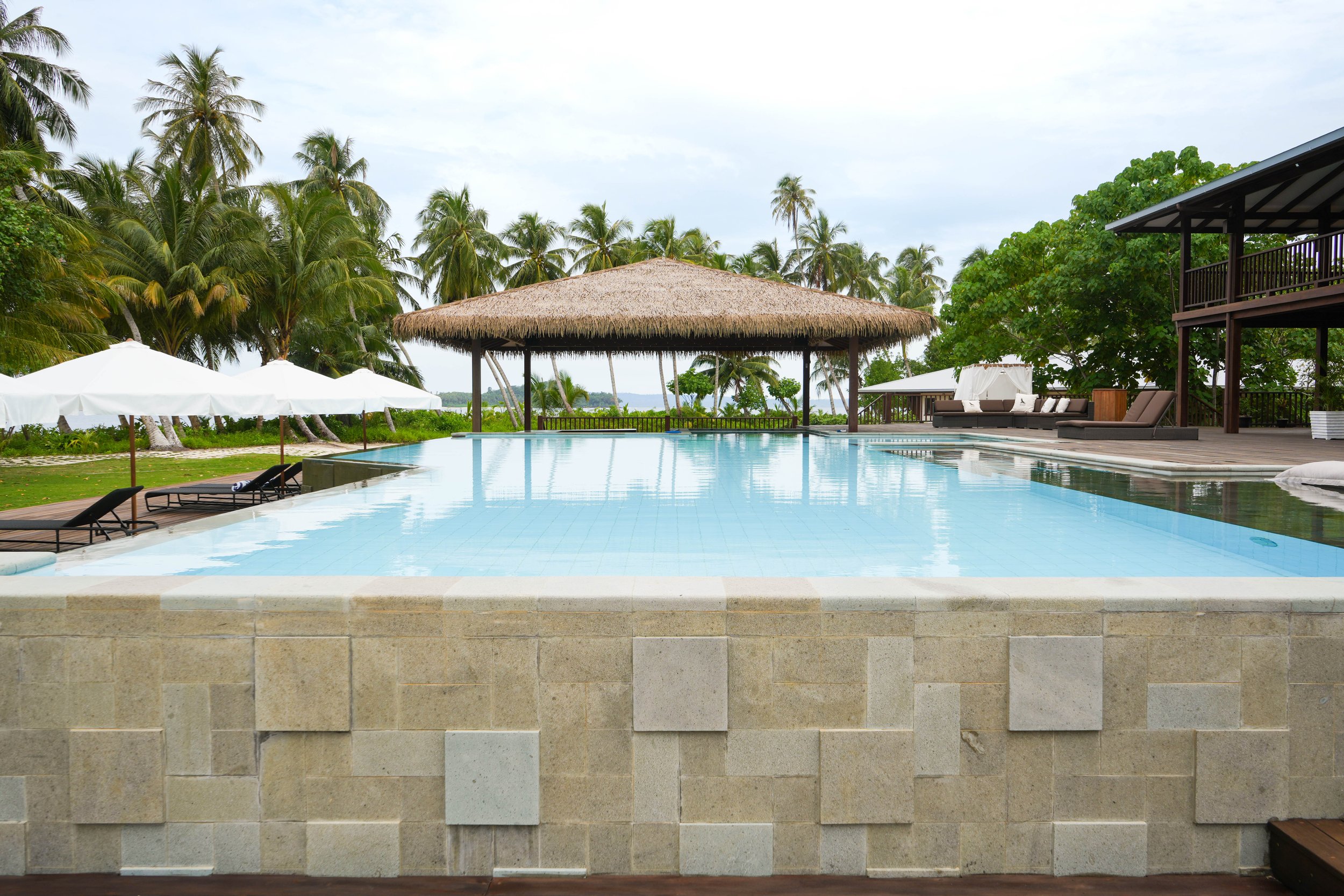 The pool at Tanah Mympi with its shaded pavilion in the background.