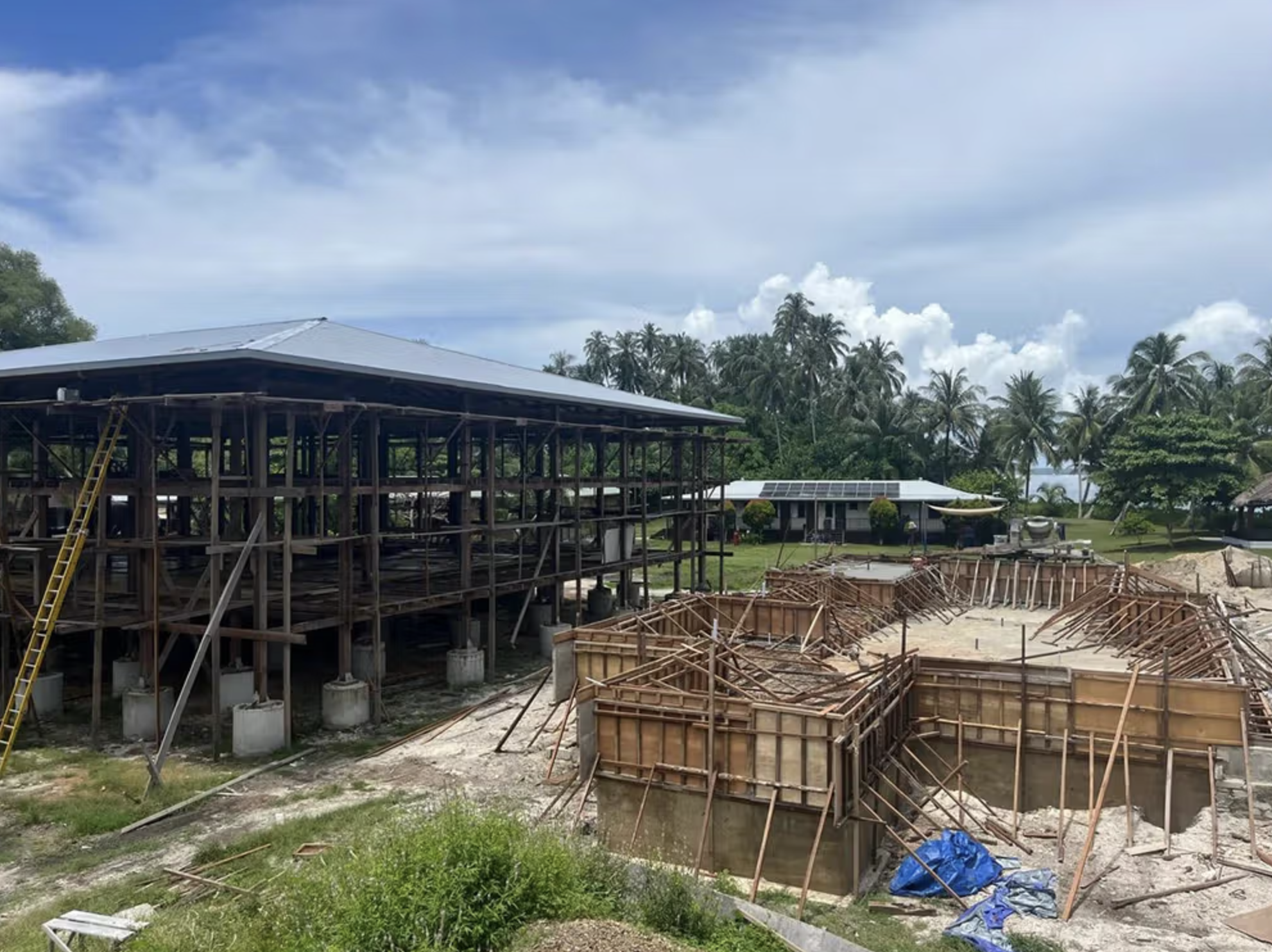 An early photo of the modest first dwelling built on Tanah Mympi's island.