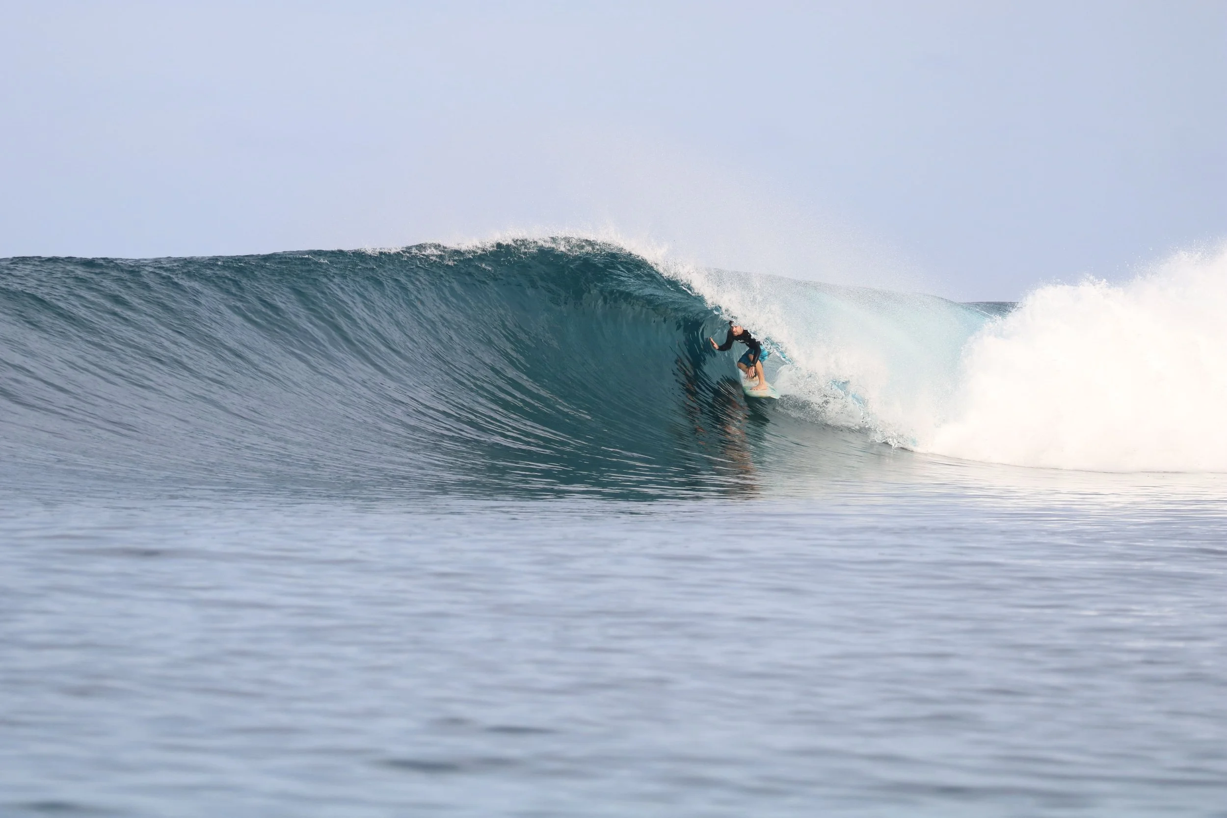 Dave at Telo Lodge, surfing during his time running the resort in the Telo Islands.