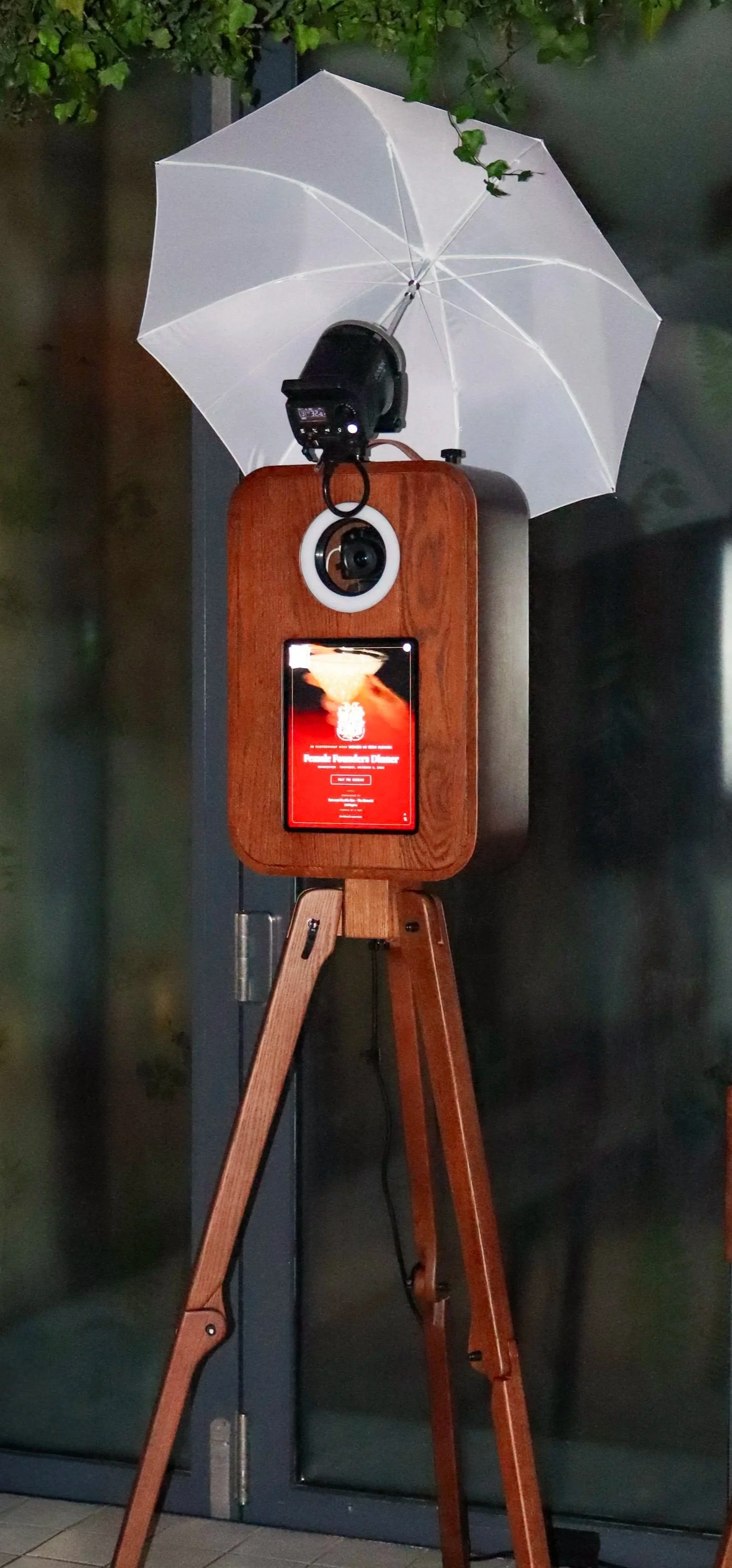 a classy, elegant, dark wood photo booth at an event in Vancouver, British Columbia